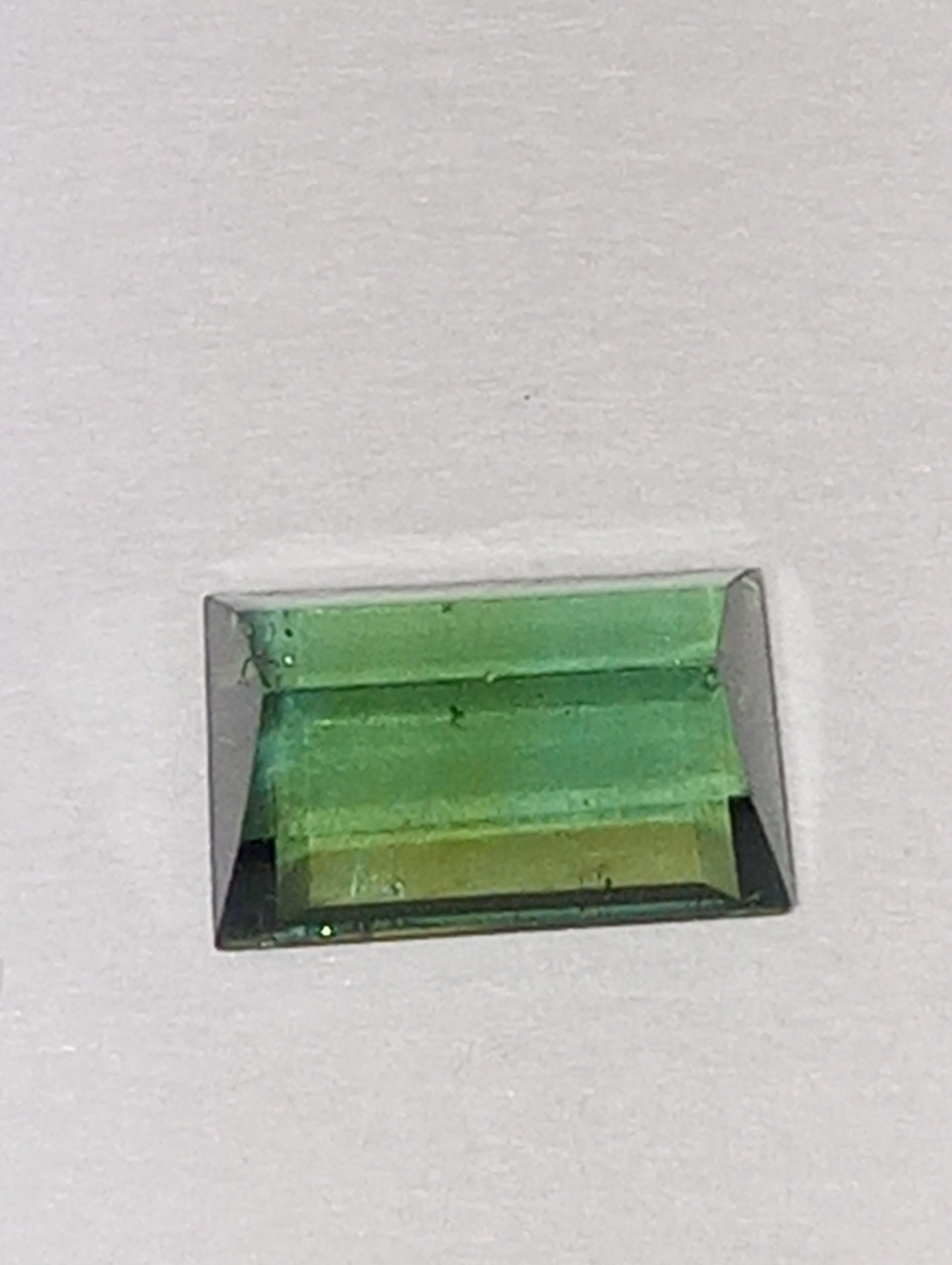 tourmaline gemstone green 6.5mmx4mm emerald cut, .63ct