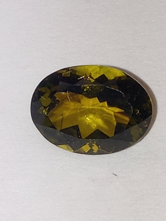 tourmaline gemstone brown green , 8mmx6mm oval cut, 1.22ct