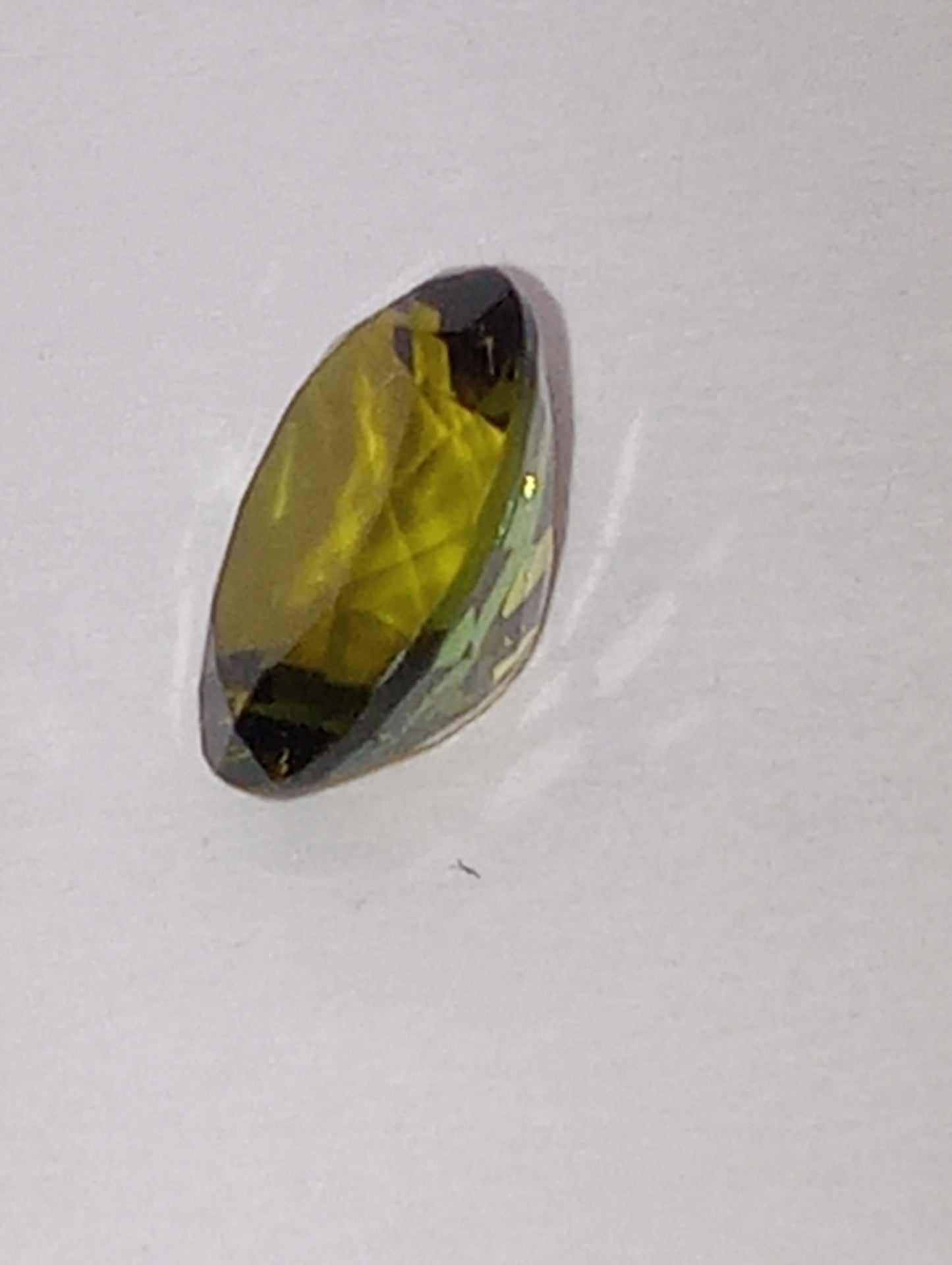 tourmaline gemstone brown green , 8mmx6mm oval cut, 1.22ct