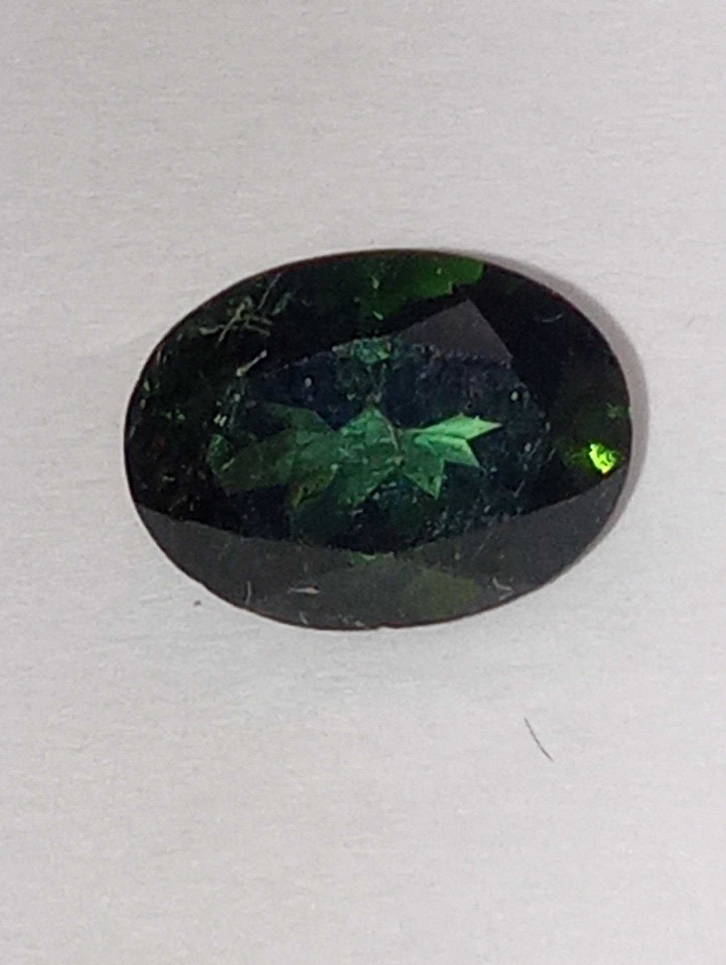 tourmaline gemstone, dark mint green, 8mmx6mm oval cut, 1.28ct