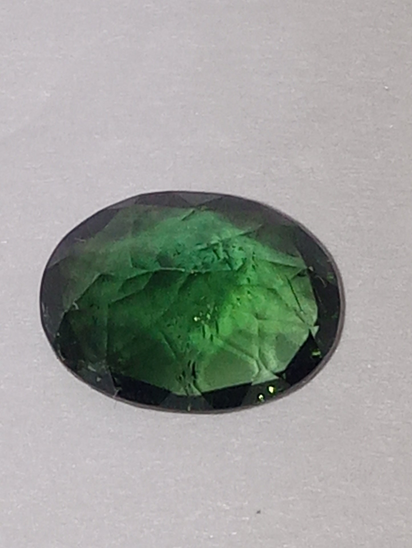 tourmaline gemstone, dark mint green, 8mmx6mm oval cut, 1.28ct
