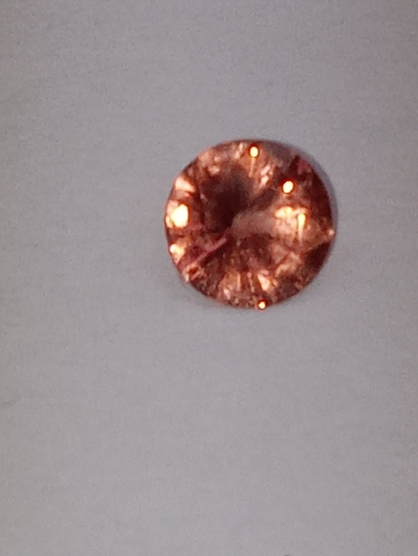 spinel gemstone Burmese, pinky orange, 6mm round cut, .63ct