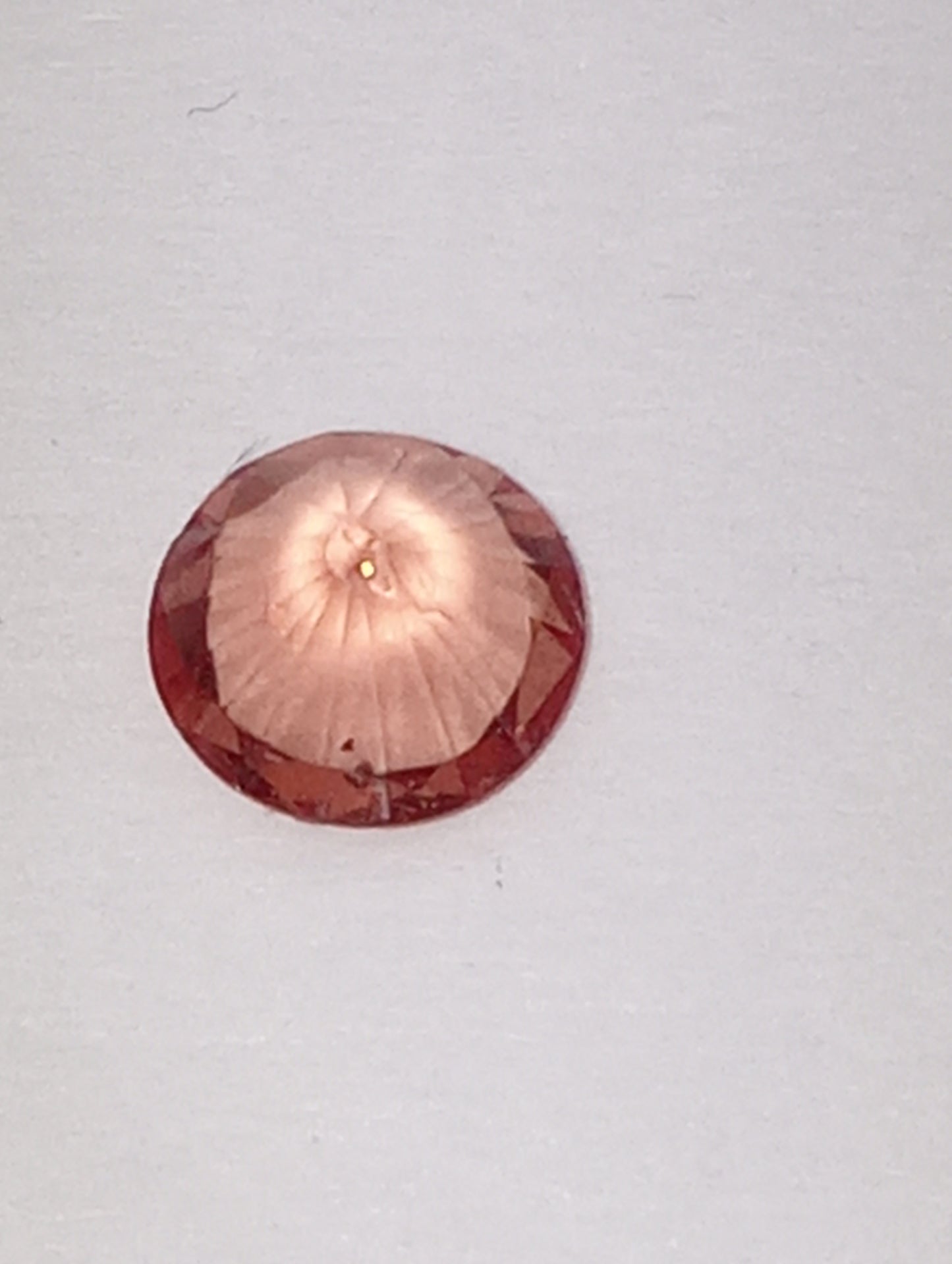 spinel gemstone Burmese, pinky orange, 6mm round cut, .63ct