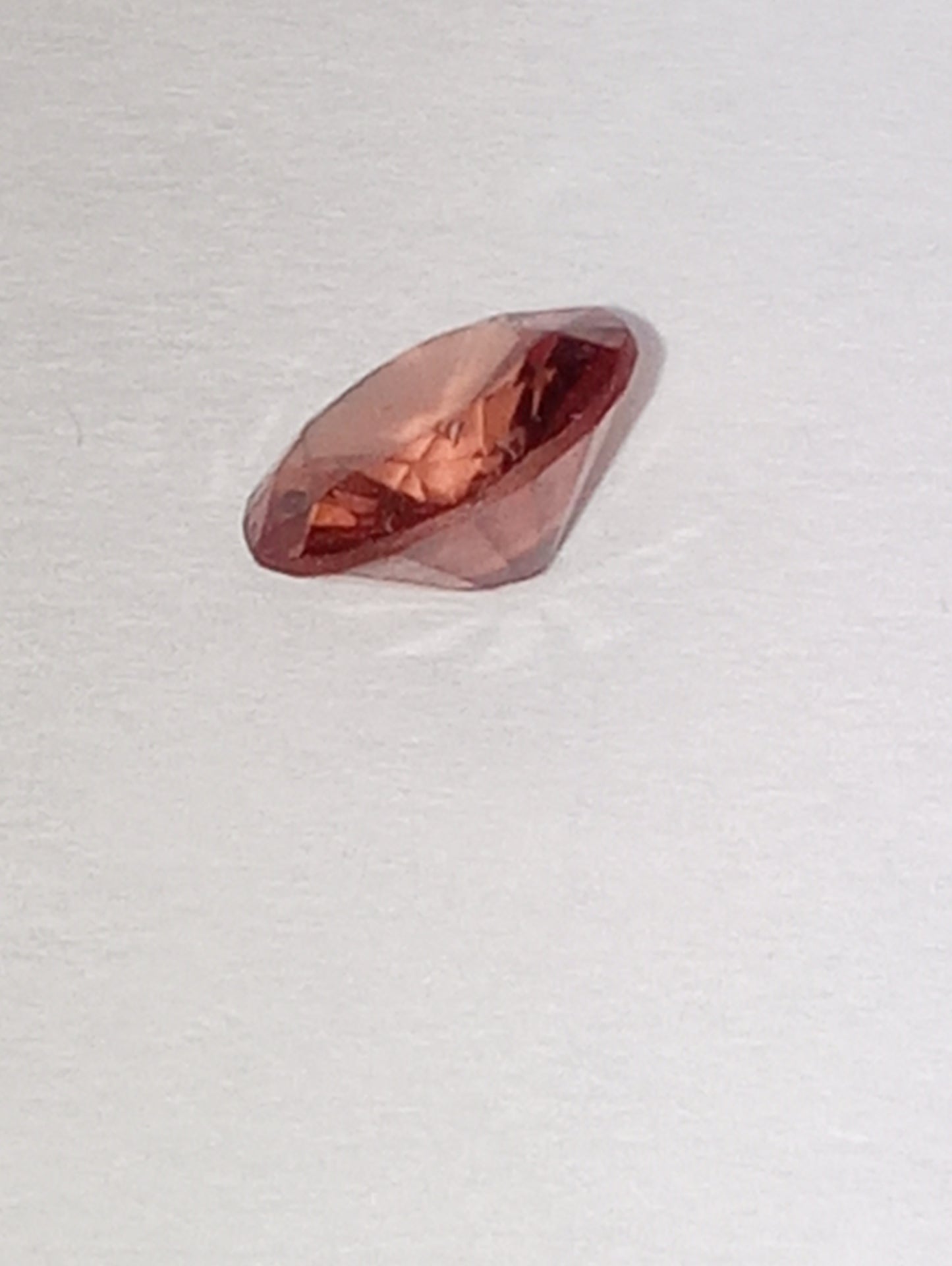 spinel gemstone Burmese, pinky orange, 6mm round cut, .63ct
