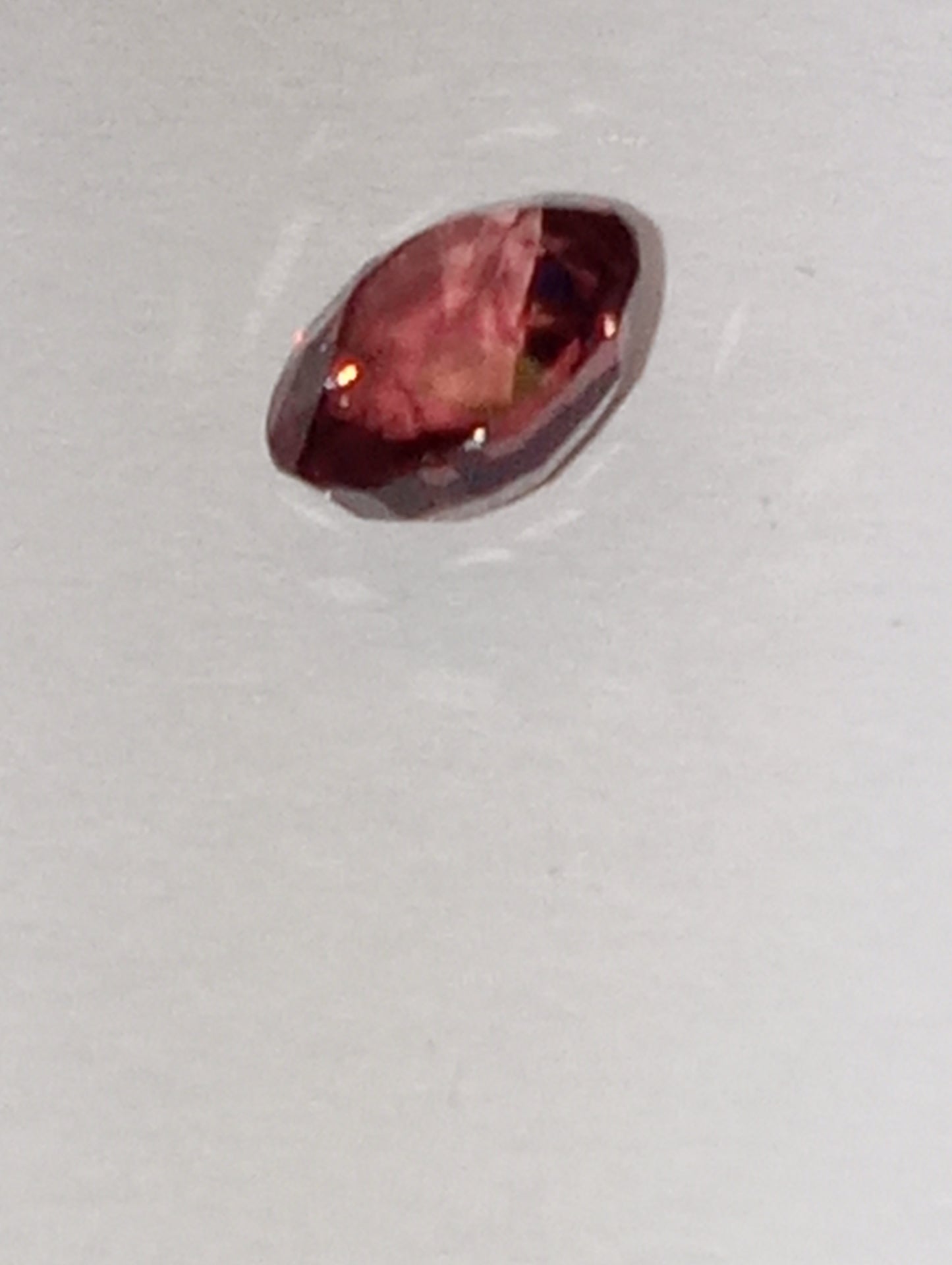 spinel gemstone Burmese, orangey pink, 6mmx5.5mm oval cut .91ct
