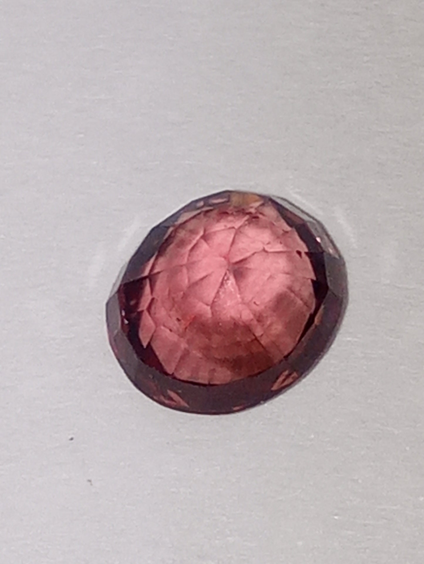 spinel gemstone Burmese, orangey pink, 6mmx5.5mm oval cut .91ct