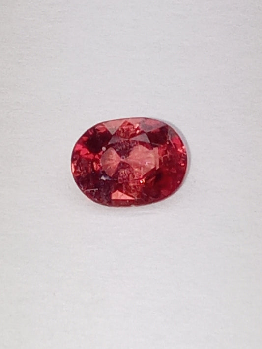spinel gemstone Burmese, red orange, padparasha color, 6mmx5mm oval cut, .62ct