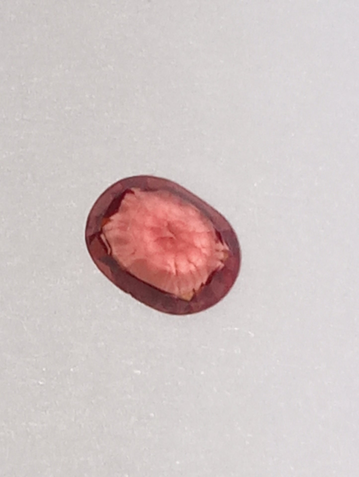 spinel gemstone Burmese, red orange, padparasha color, 6mmx5mm oval cut, .62ct
