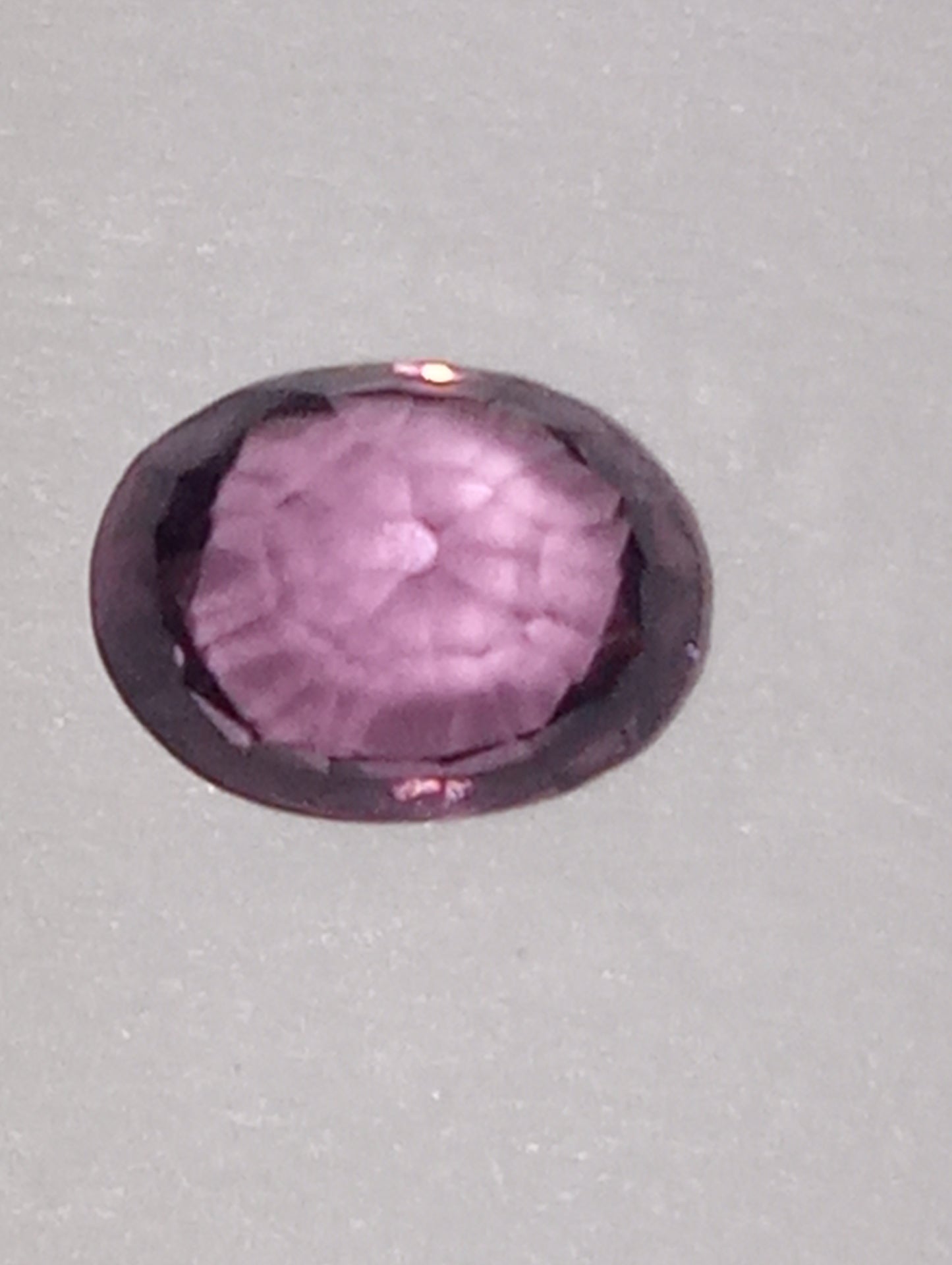 spinel gemstone Burmese, pinky purple, 5mmx4mm oval cut, .62ct