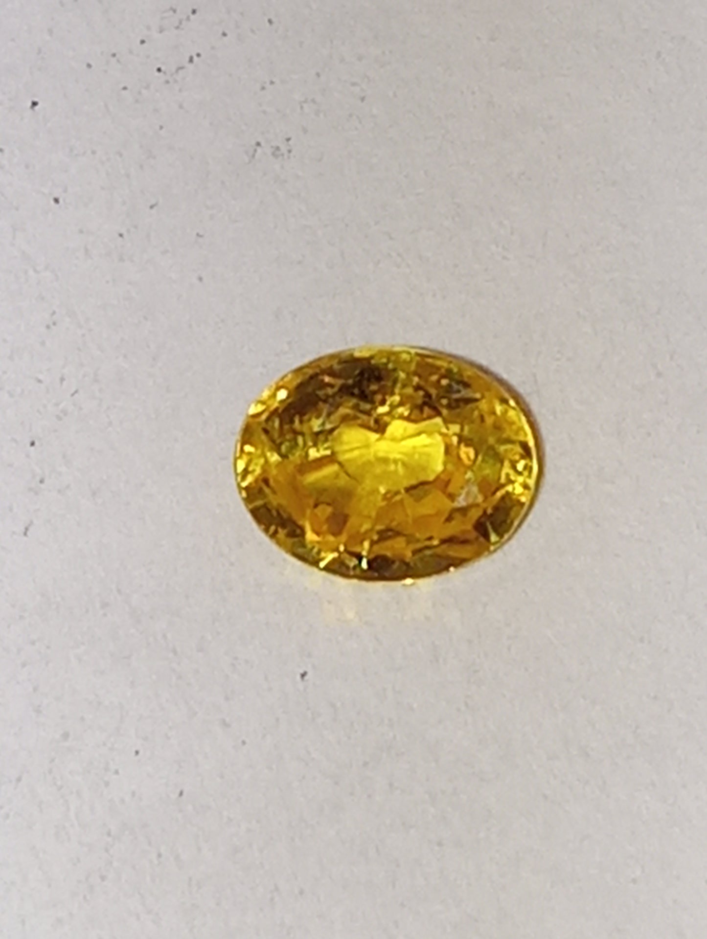 sapphire gemstone yellow vivid, 4.5mmx5.75mm oval cut, .66ct