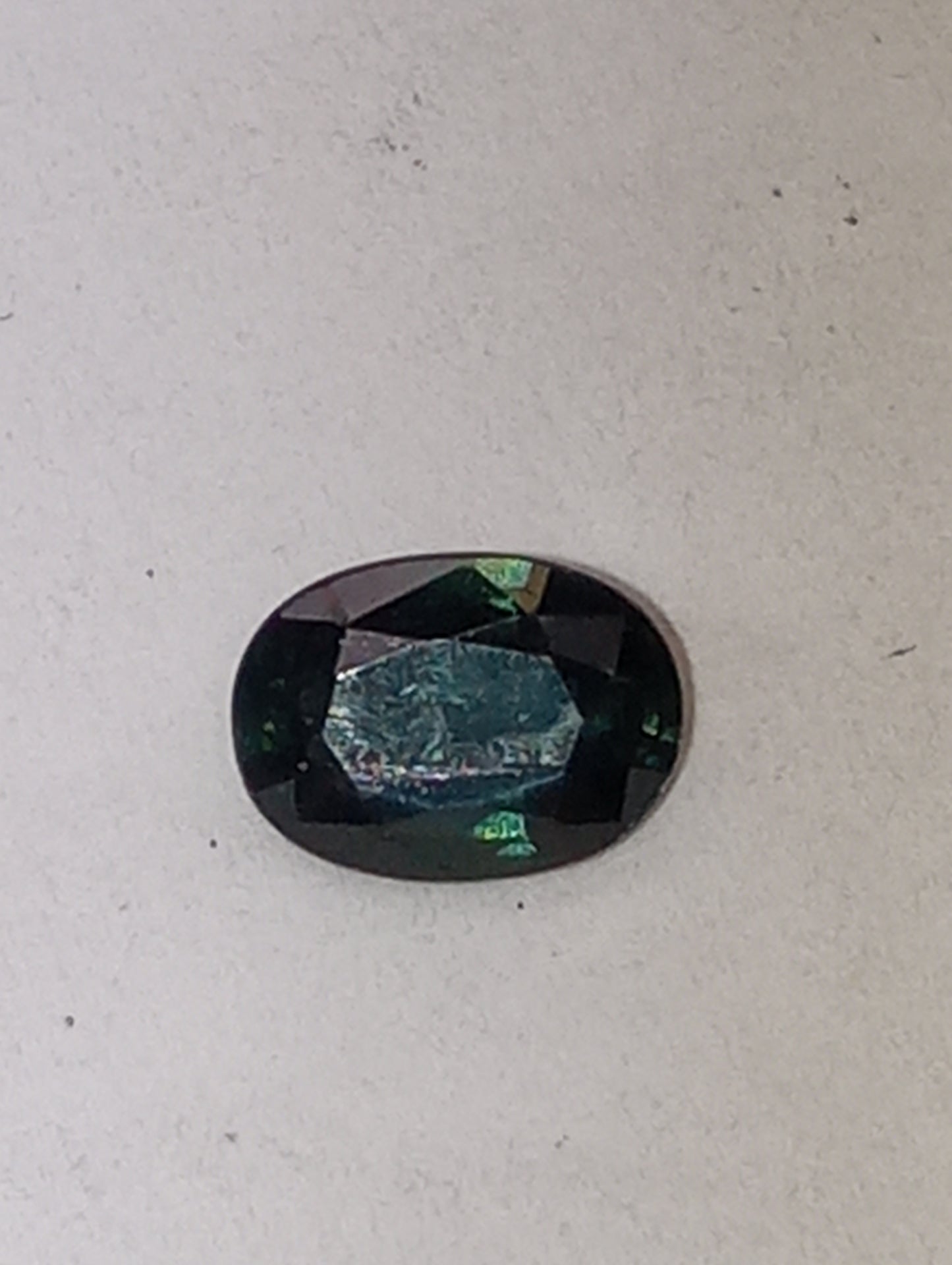 sapphire gemstone teal. 7mmx5mm oval cut, .81ct