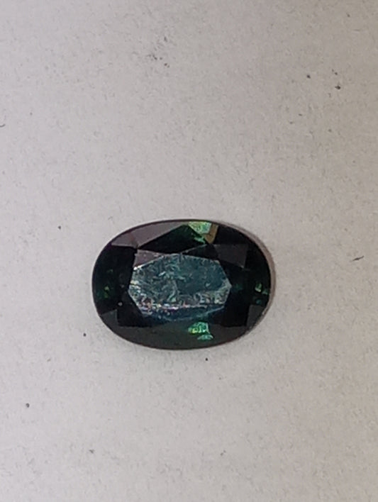 sapphire gemstone teal. 7mmx5mm oval cut, .81ct