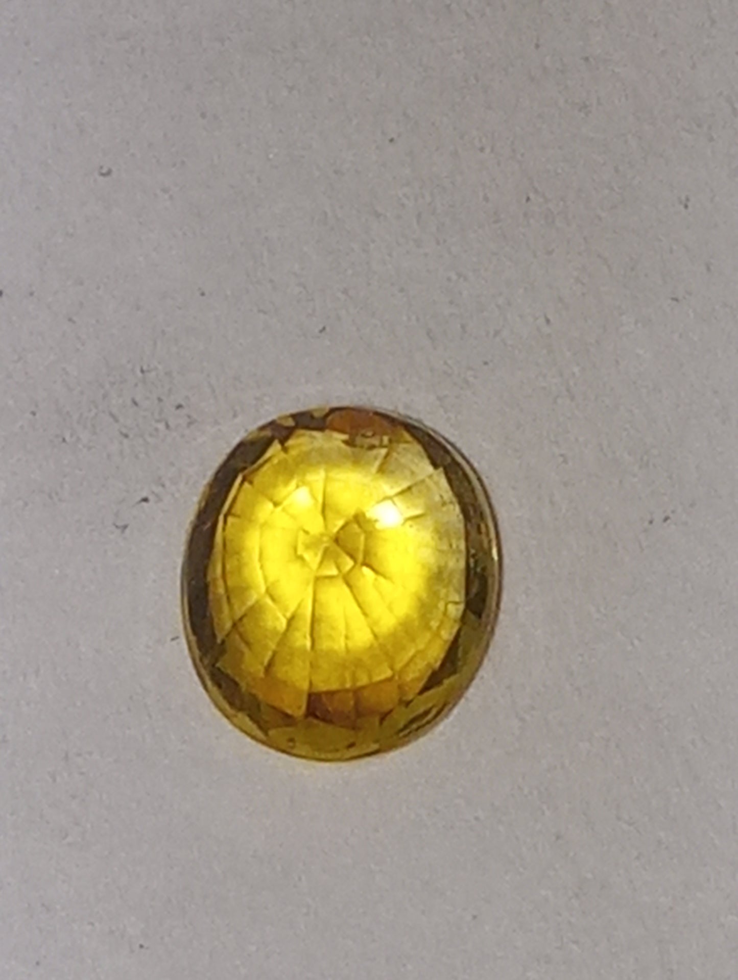 sapphire gemstone, yellow canary, 6mmx5mm oval cut, .71ct