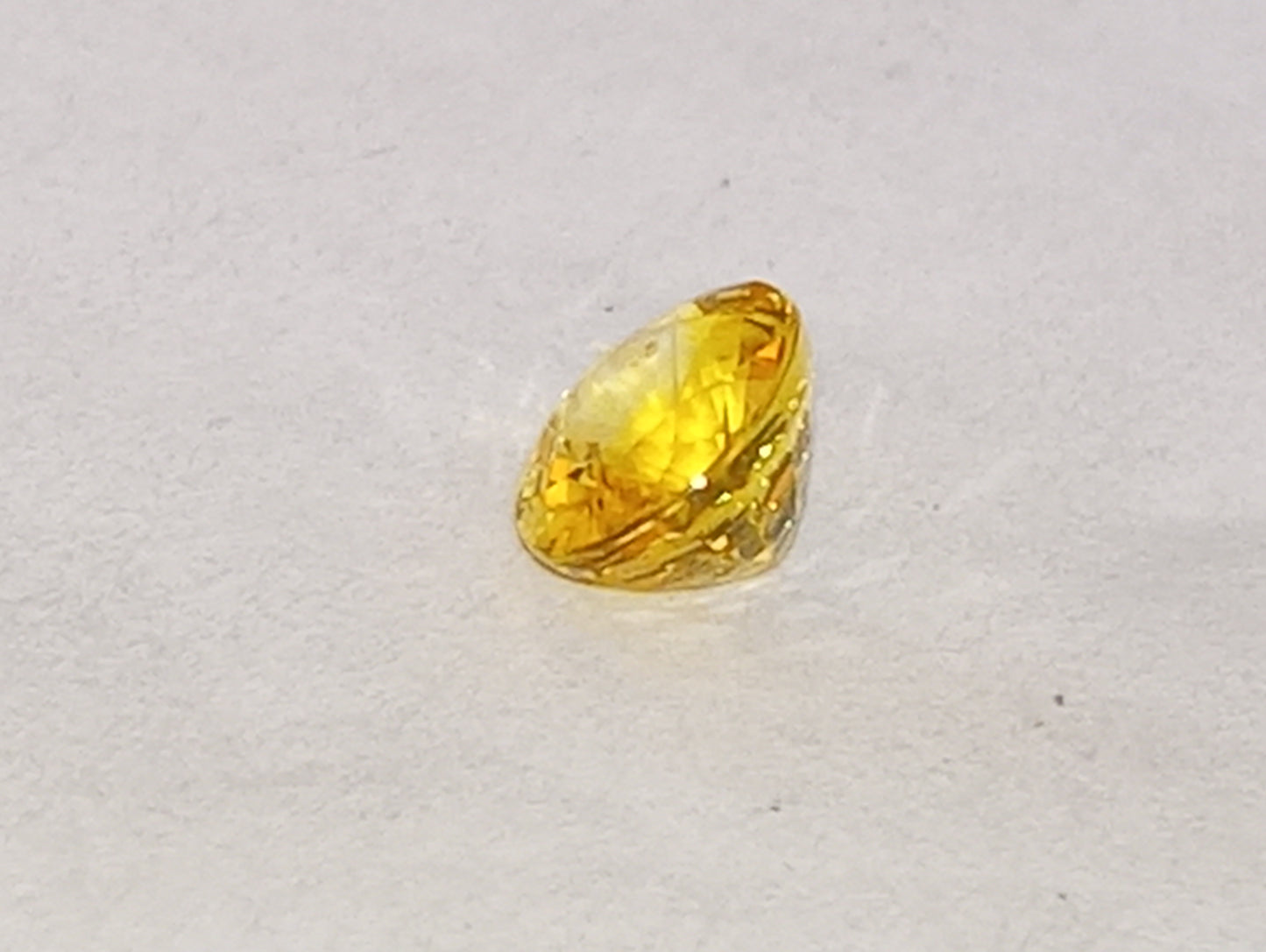 sapphire gemstone, yellow canary, 6mmx5mm oval cut, .71ct