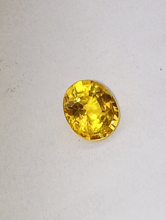 sapphire gemstone, yellow canary, 6mmx5mm oval cut, .71ct
