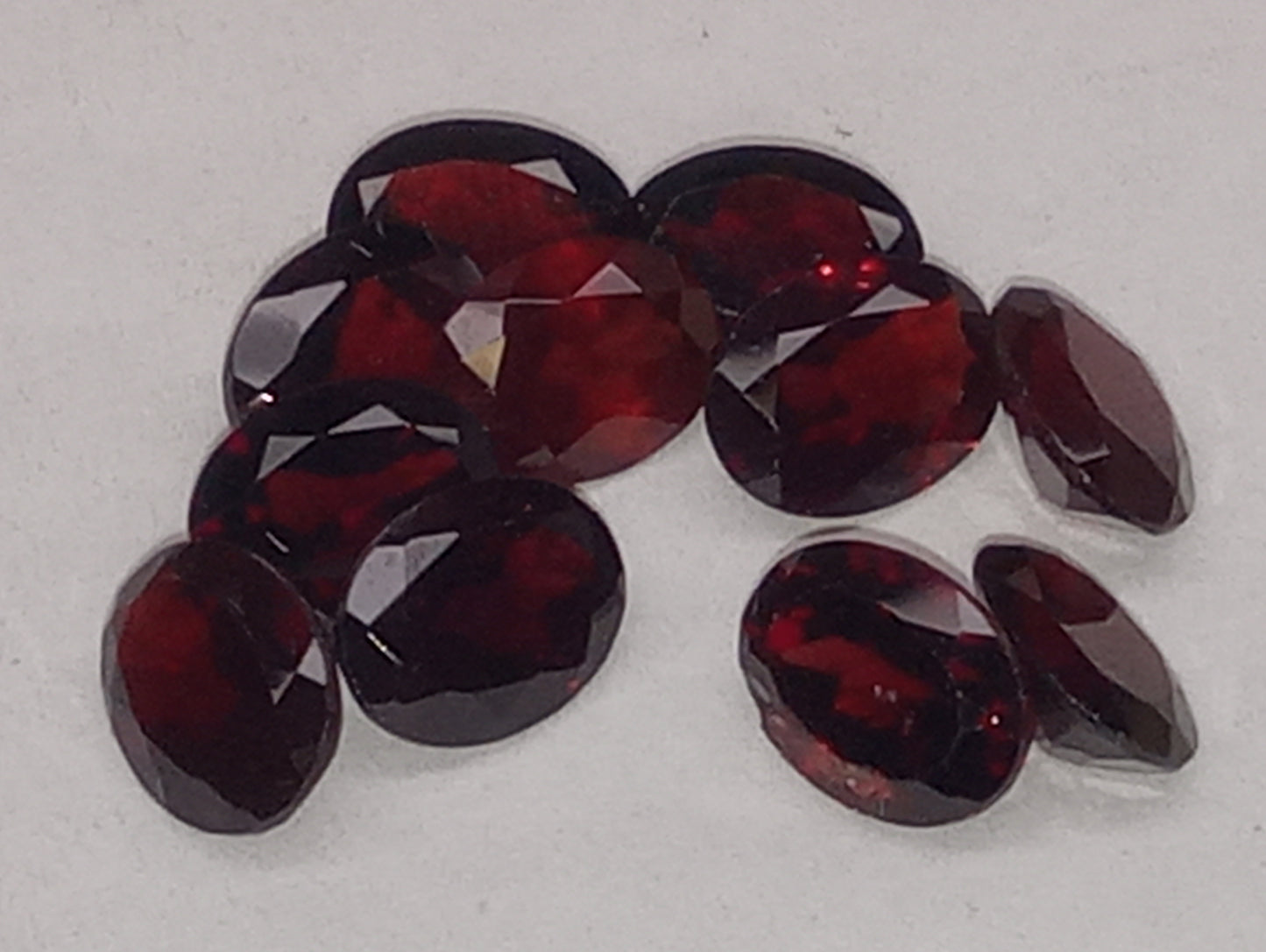 garnet gemstones, red, Orissa, 8mmx6mm oval cut,  11 stones