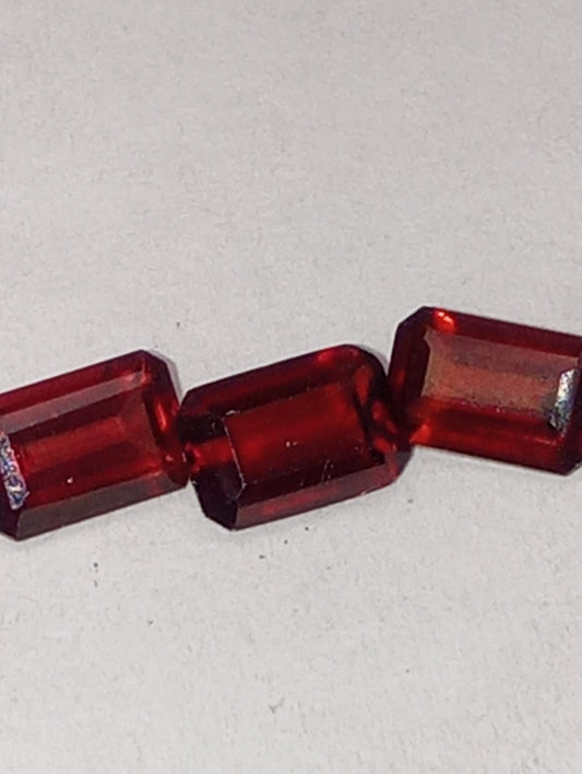 garnet gemstones, red, 6mmx4mm emerald cut, 3 stones
