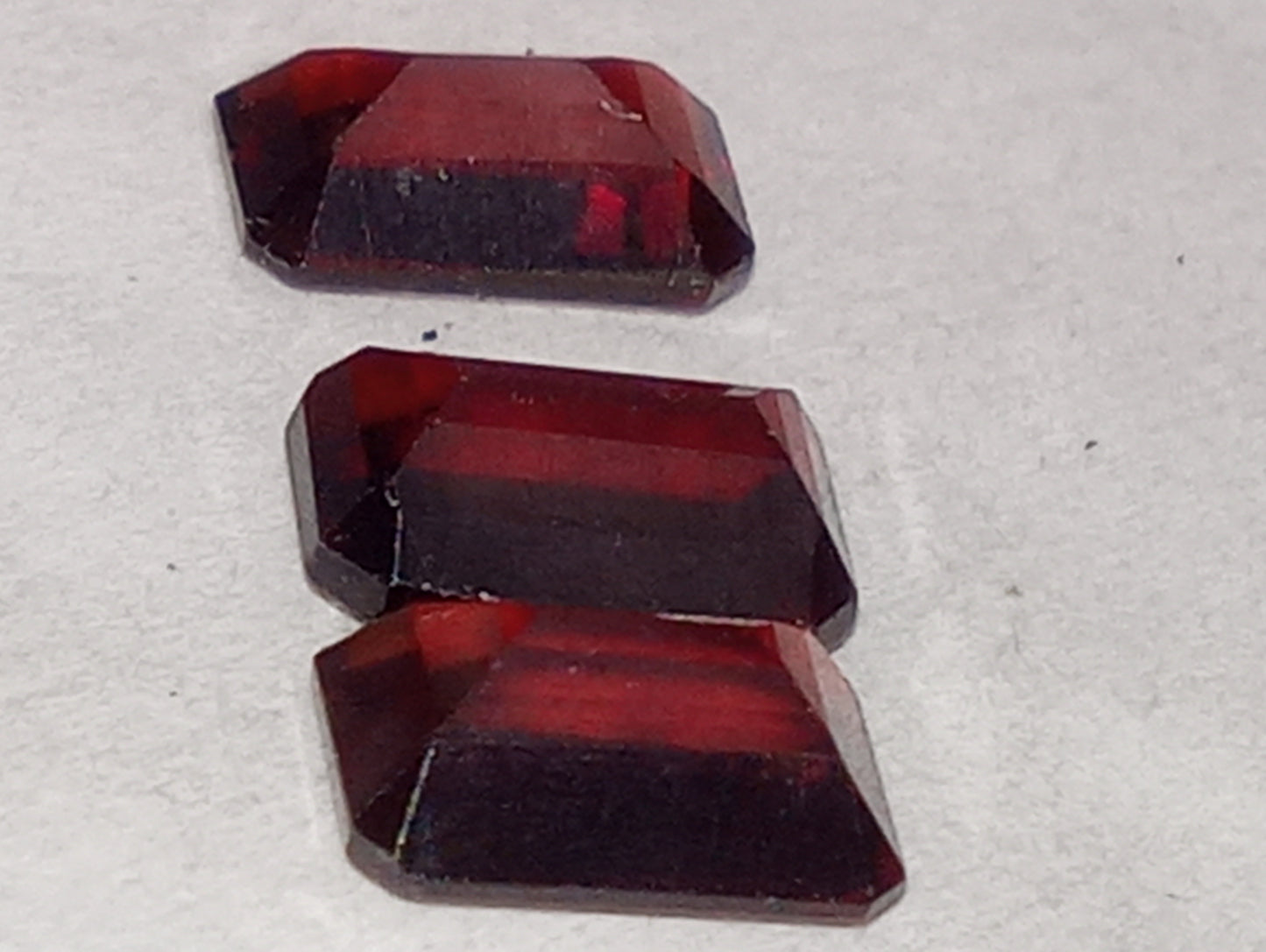 garnet gemstones, red, 6mmx4mm emerald cut, 3 stones