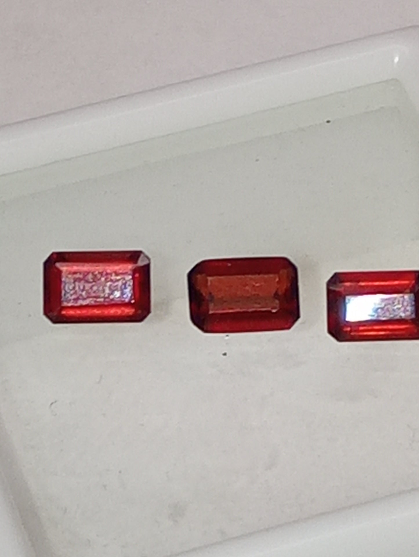 garnet gemstones, red, 6mmx4mm emerald cut, 3 stones