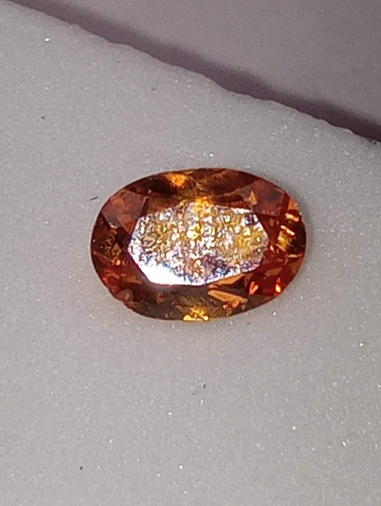 garnet gemstone, mandarin spessartite, 7mmx5mm oval cut, .76ct