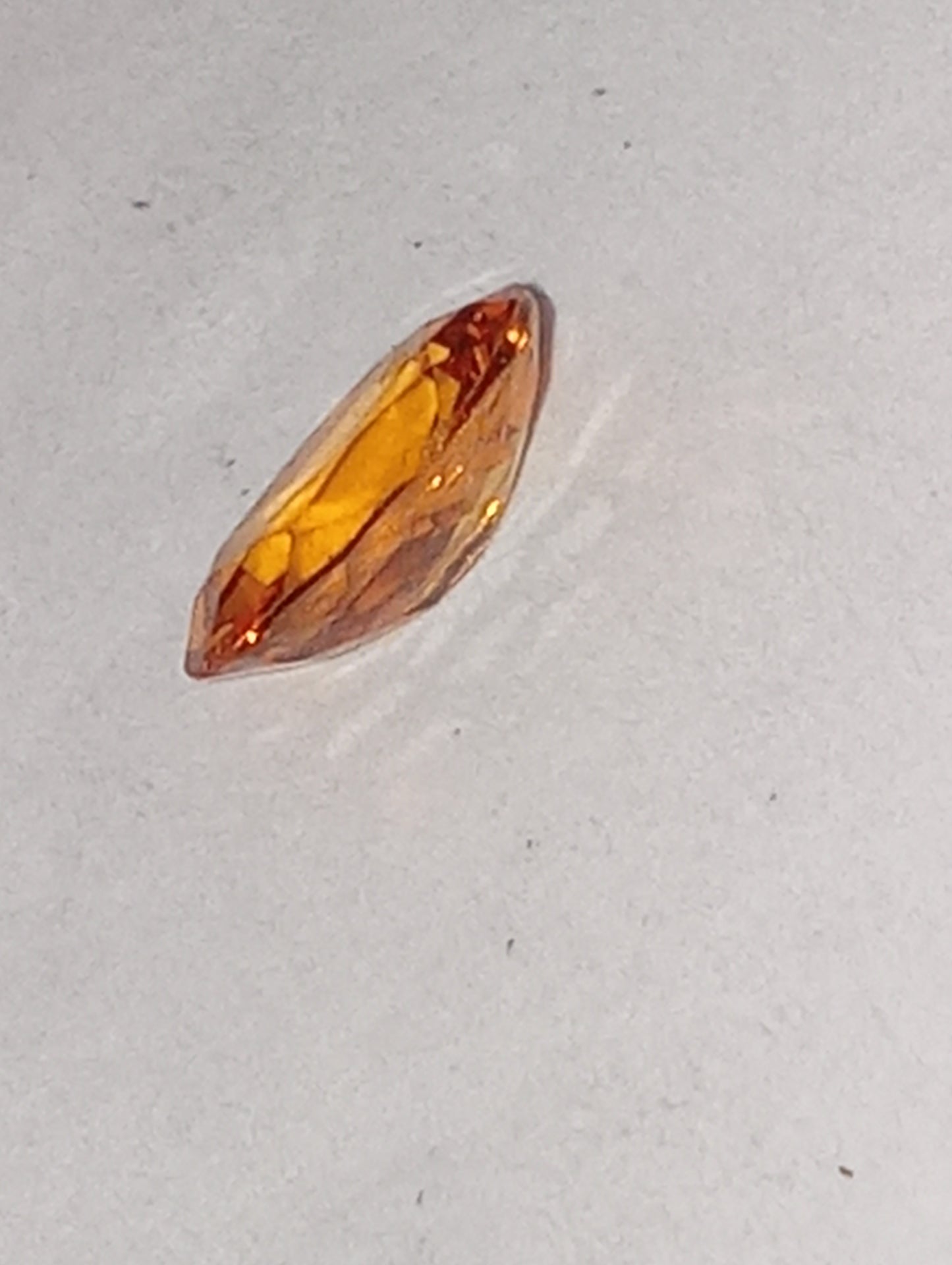 garnet gemstone, mandarin spessartite, 7mmx5mm oval cut, .76ct