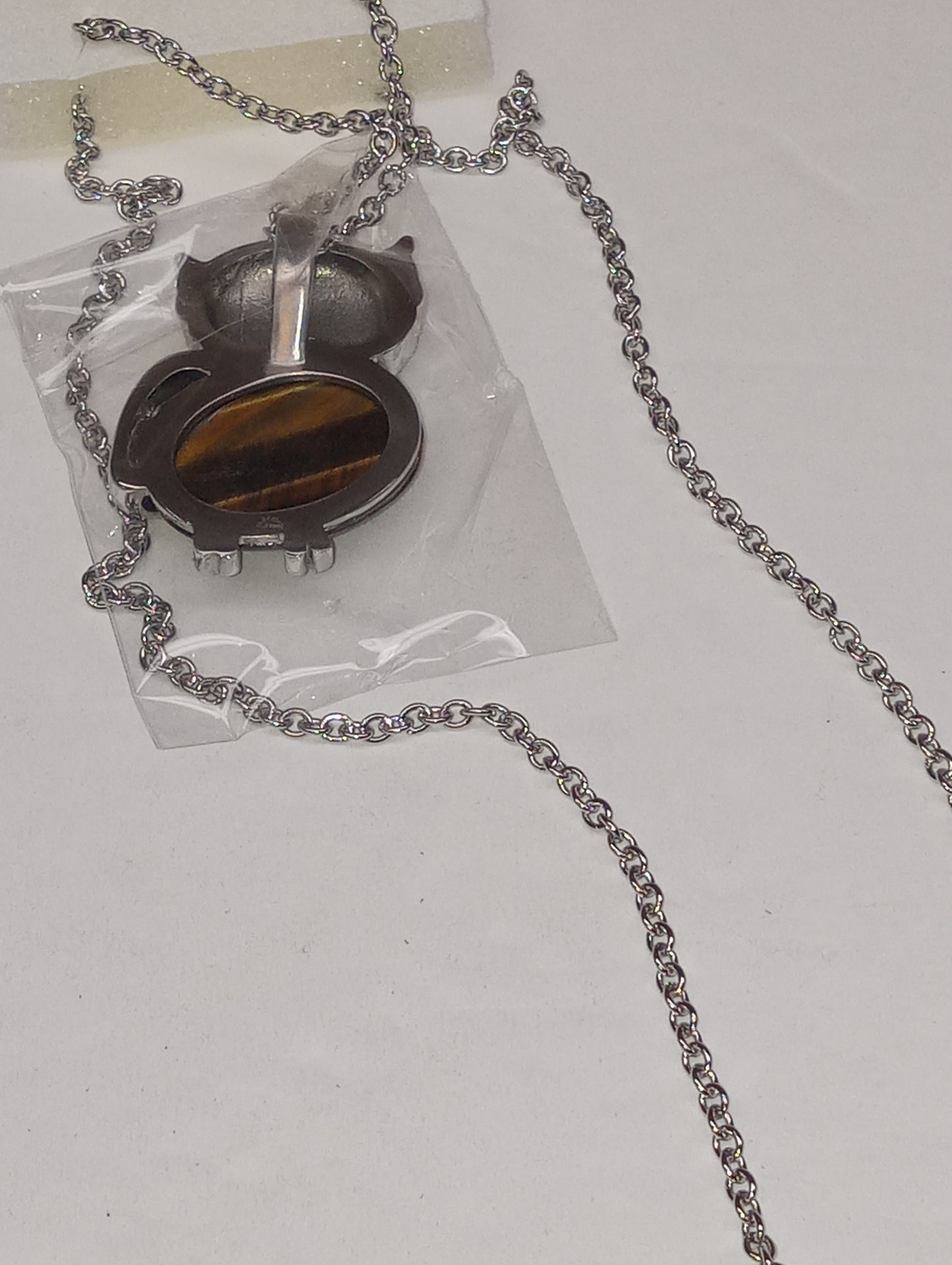 pendant necklace, tiger"s eye South African yellow, white and black Austrian crystal owl 20inches, in stainless steel