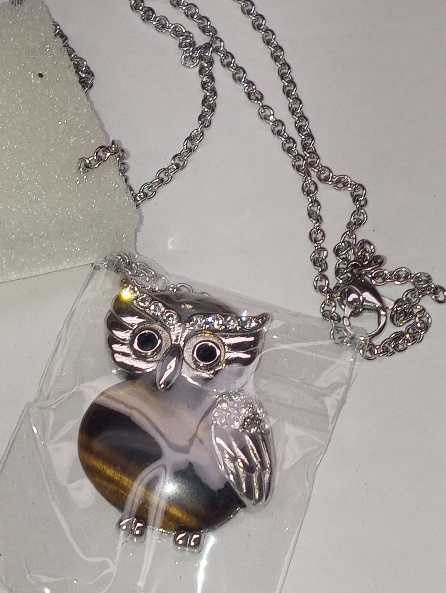 pendant necklace, tiger"s eye South African yellow, white and black Austrian crystal owl 20inches, in stainless steel