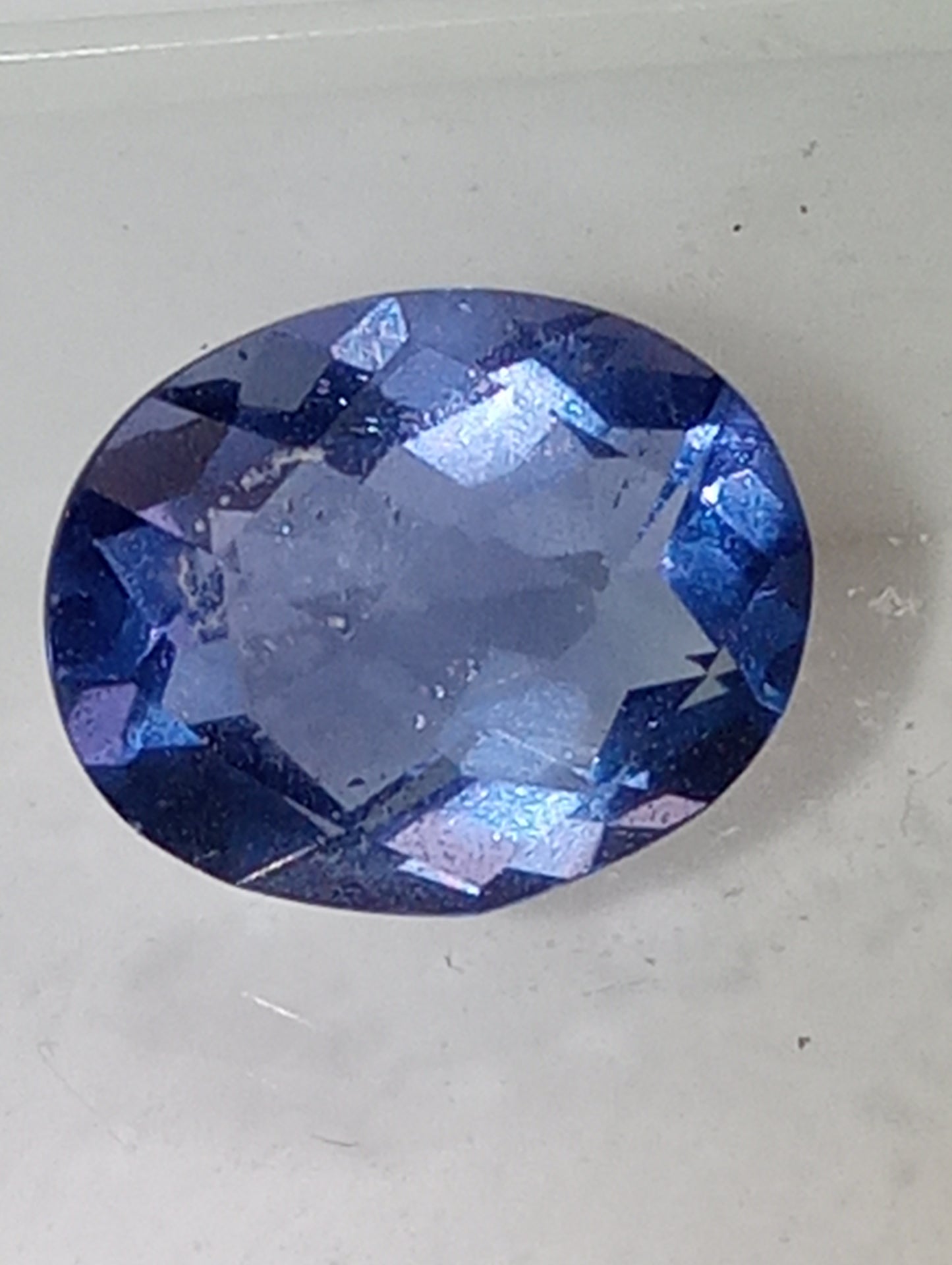 fluorite gemstone blue-purple color shift, 11mmx9mm oval cut, 4.21cts