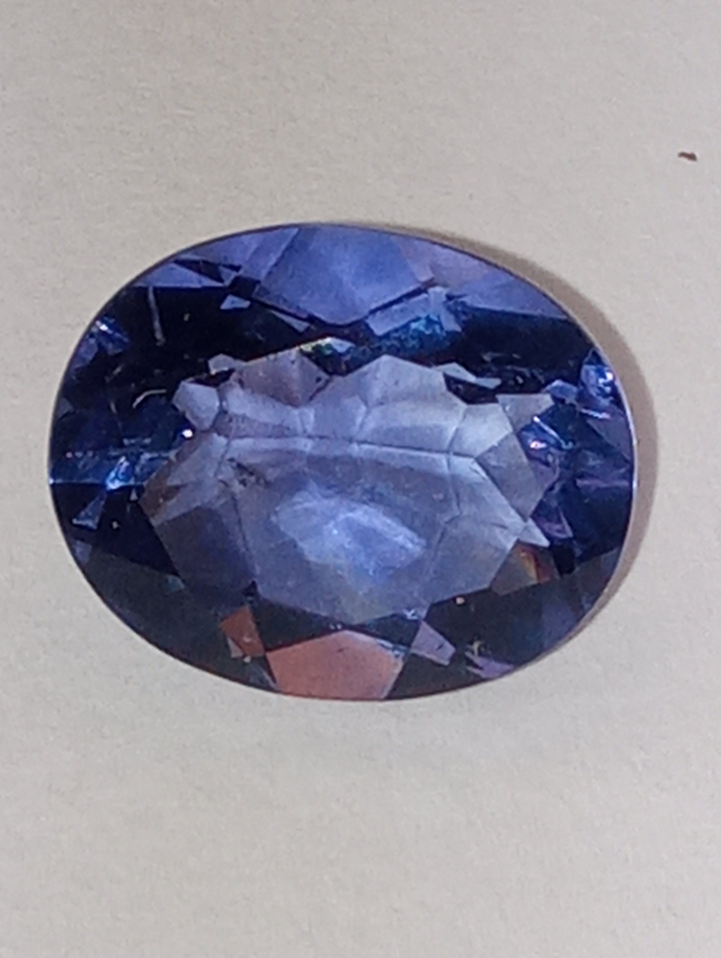 fluorite gemstone, blue-purple color shift, 11mmx9mm oval cut, 4.04ct