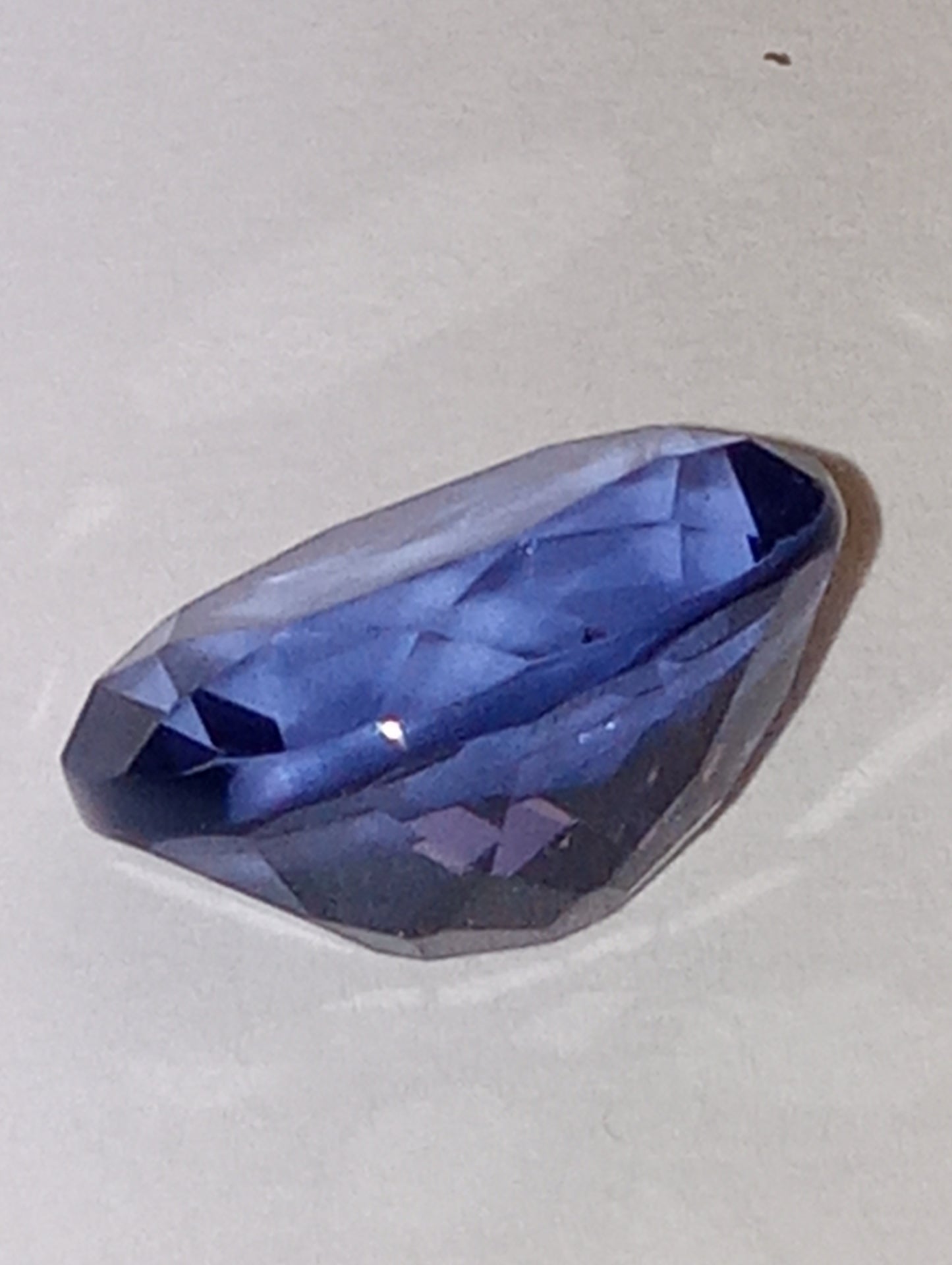 fluorite gemstone, blue-purple color shift, 11mmx9mm oval cut, 4.04ct
