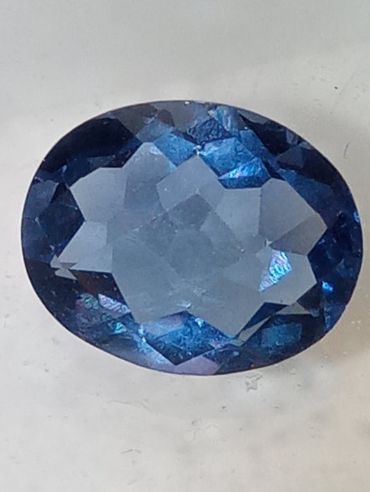 fluorite gemstone, color shift, blue-purple, 10mmx8mm oval cut, 2.82ct