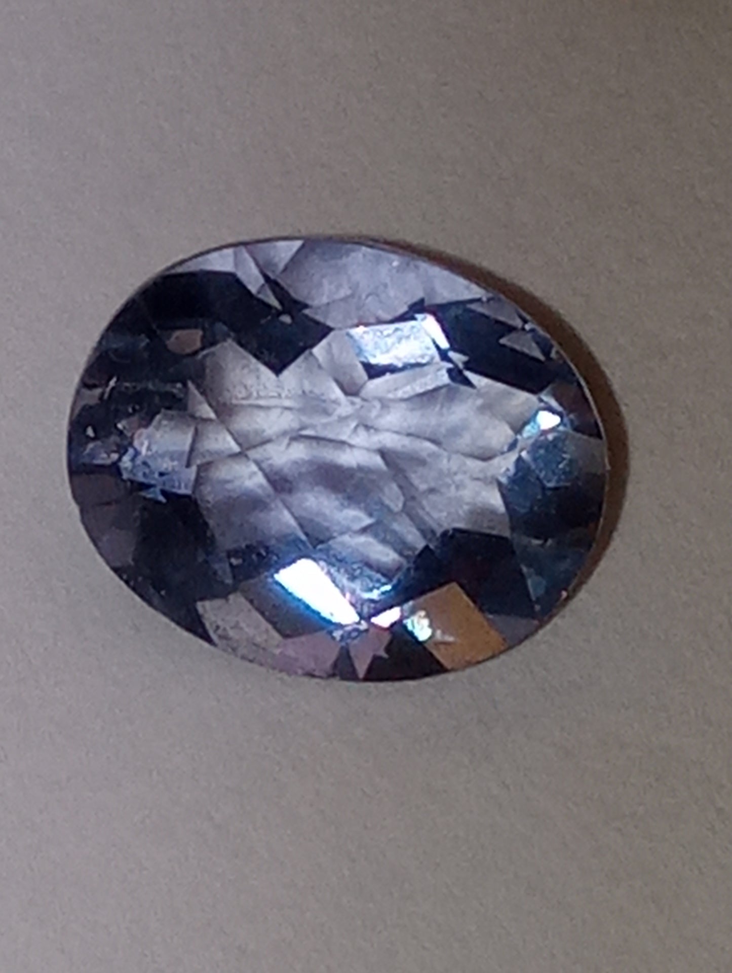fluorite gemstone, color-shift blue-purple, 10mmx8mm oval cut, 3.25ct