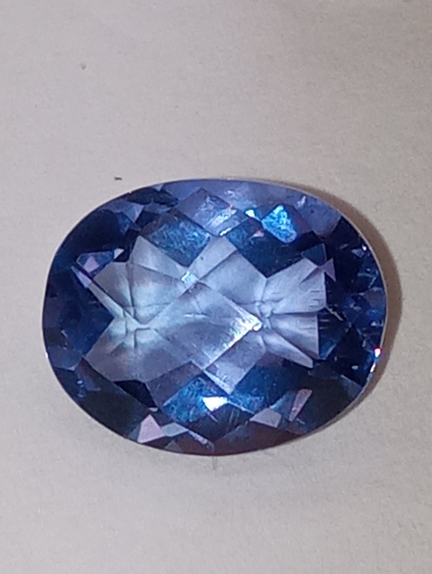 fluorite gemstone, color shift, blue-purple, 11mmx9mm oval cut, 4.08ct