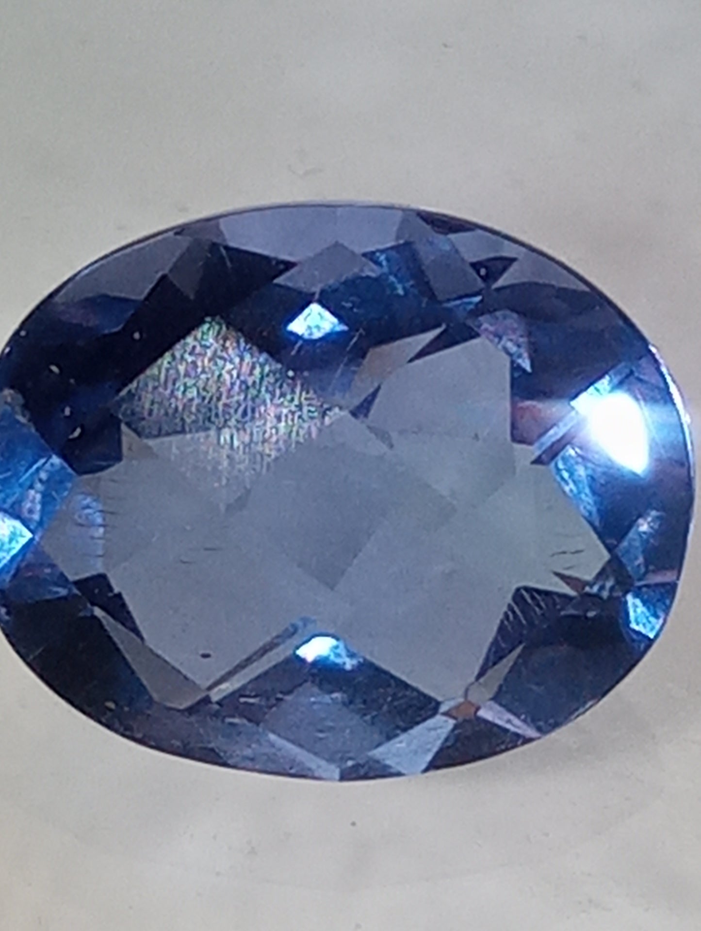 fluorite gemstone, color shift, blue-purple, 11mmx9mm oval cut, 4.08ct