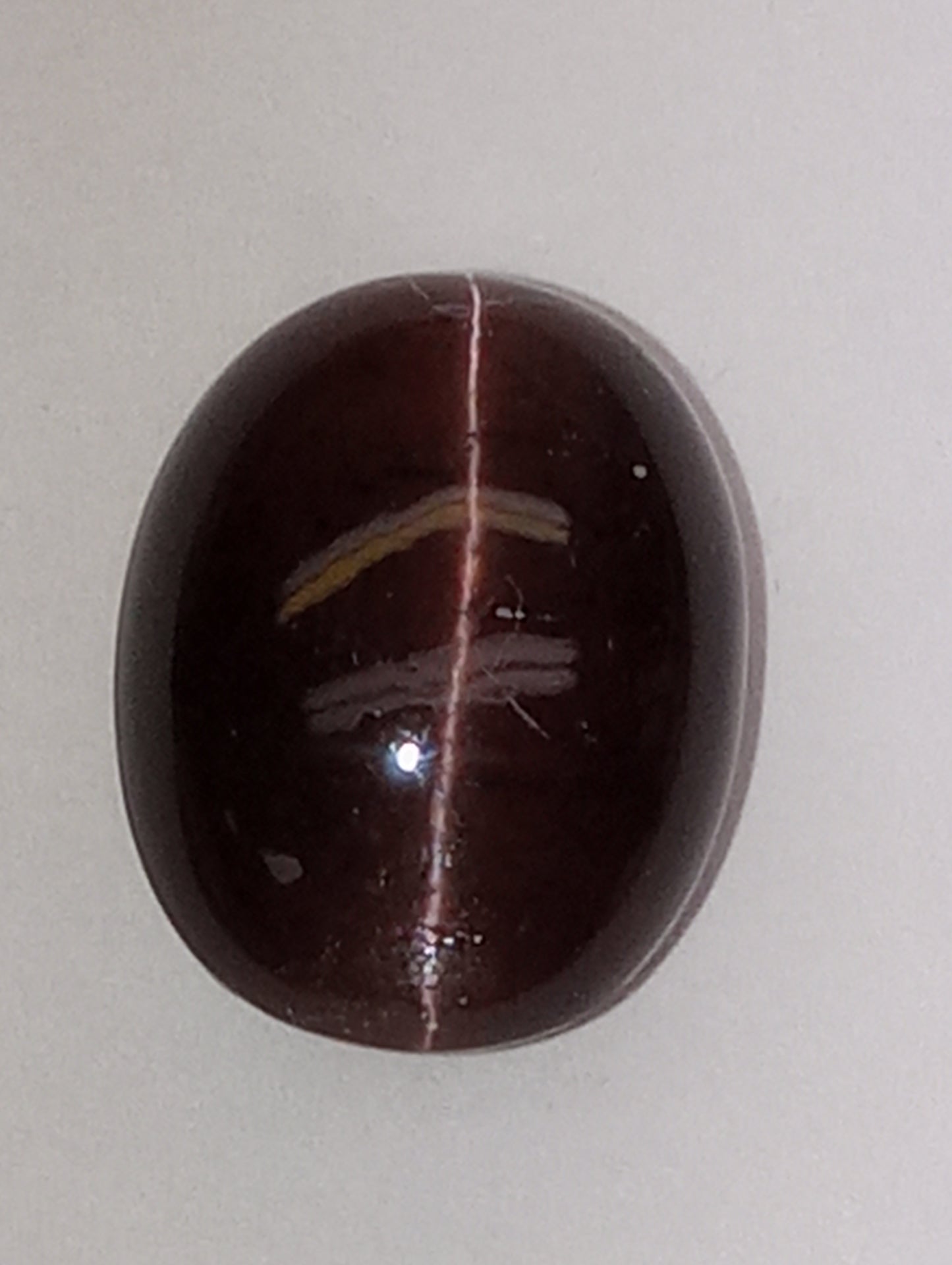 spectrolite gemstone, cats-eye cabachon cut oval, 12.28ct