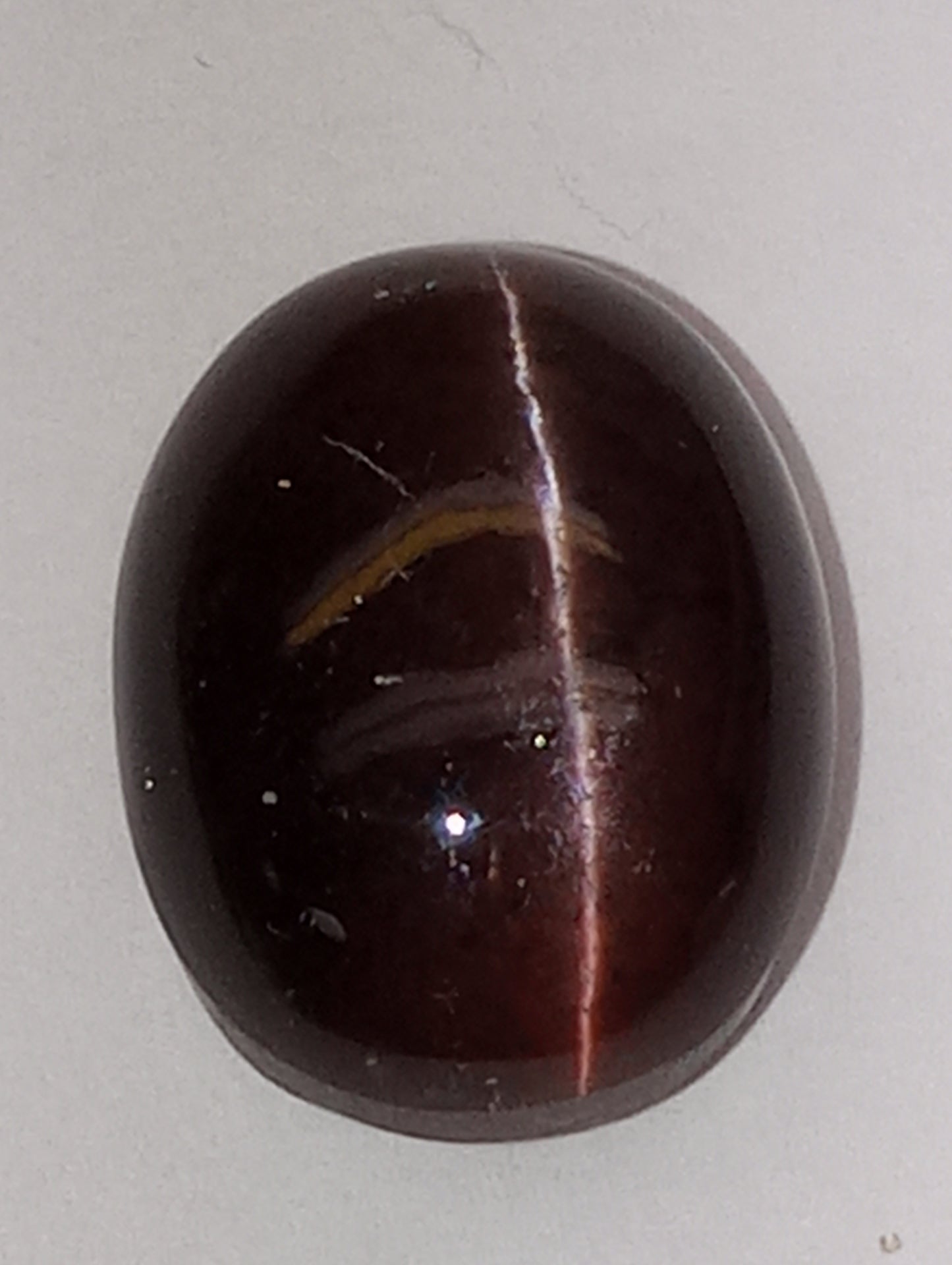 spectrolite gemstone, cats-eye cabachon cut oval, 12.28ct