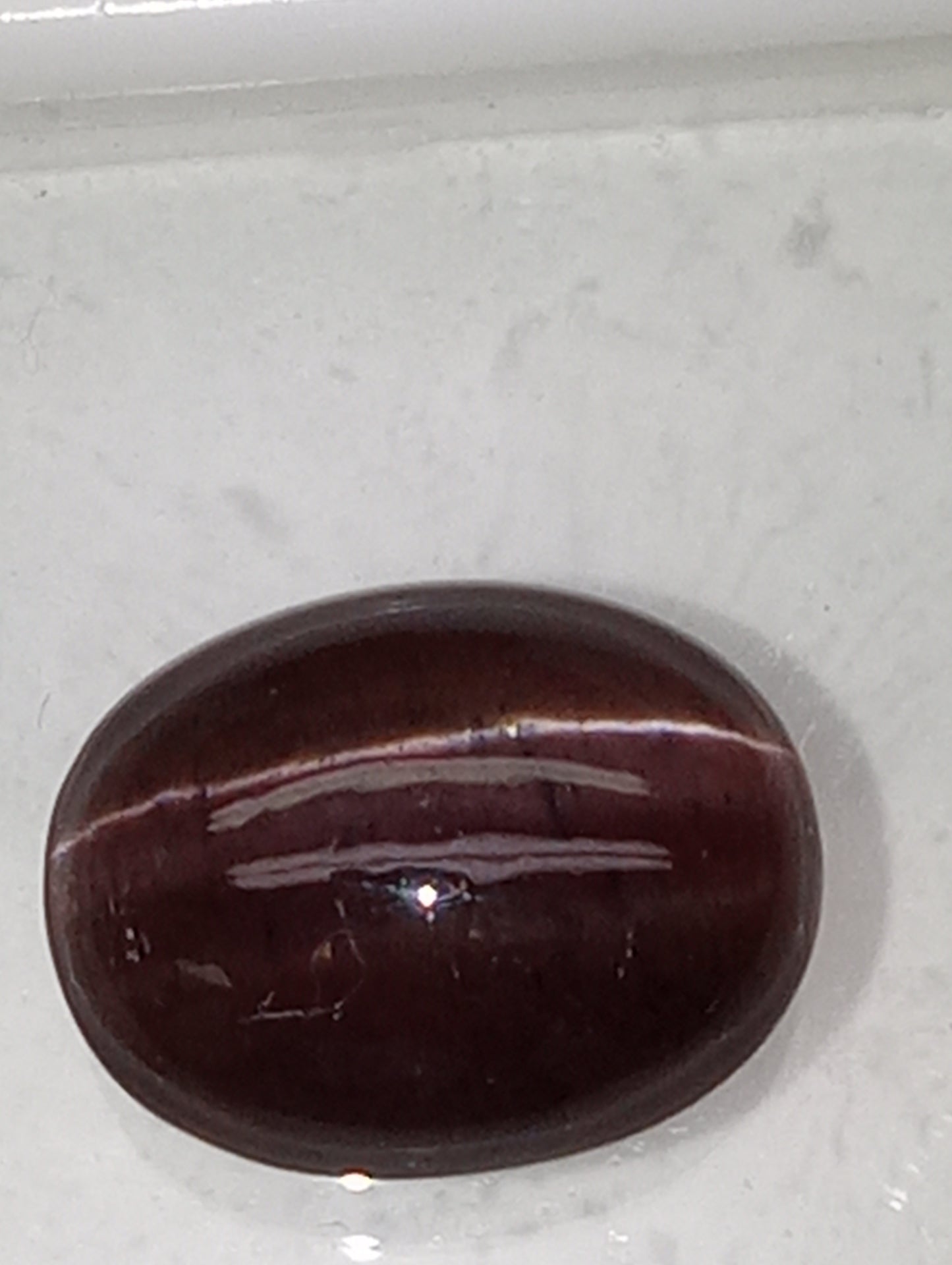 spectrolite gemstone, cats-eye cabachon cut oval, 12.28ct