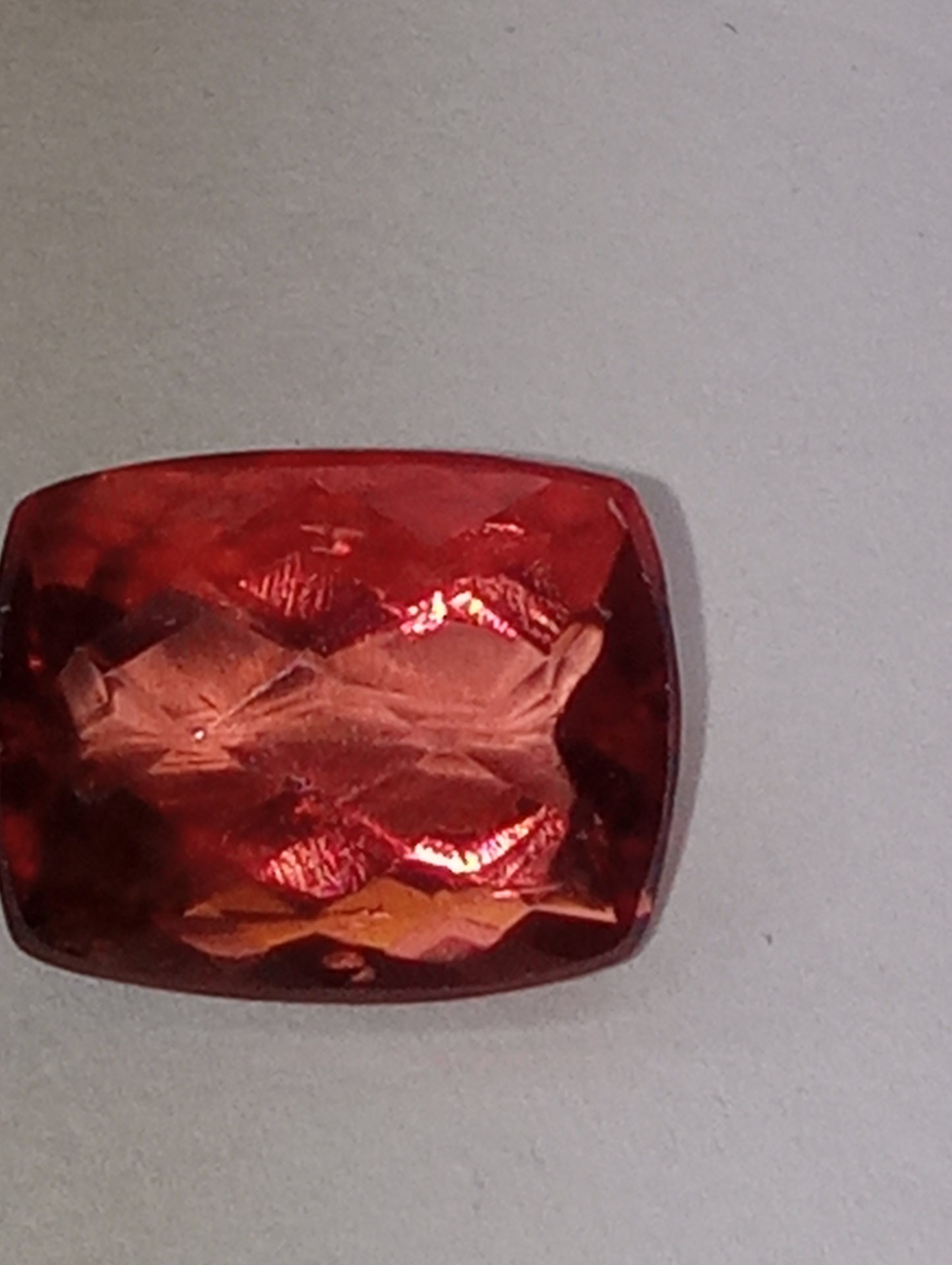fluorite gemstone, red, 11mmx8.5mm cushion cut, 4.46ct