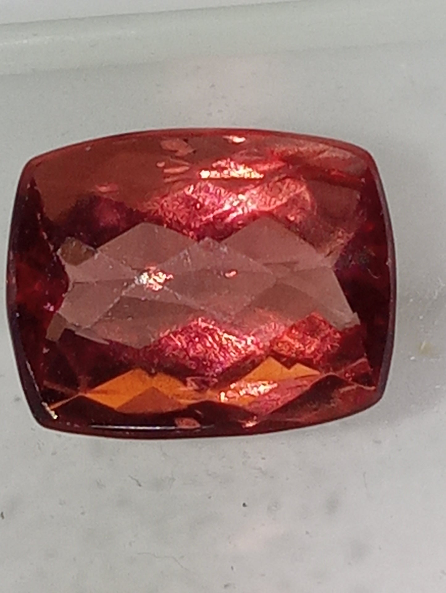 fluorite gemstone, red, 11mmx8.5mm cushion cut, 4.46ct