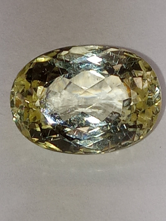 Teradora (TM)  gemstone, yellow, 14x10mm oval cut, 8.43ct