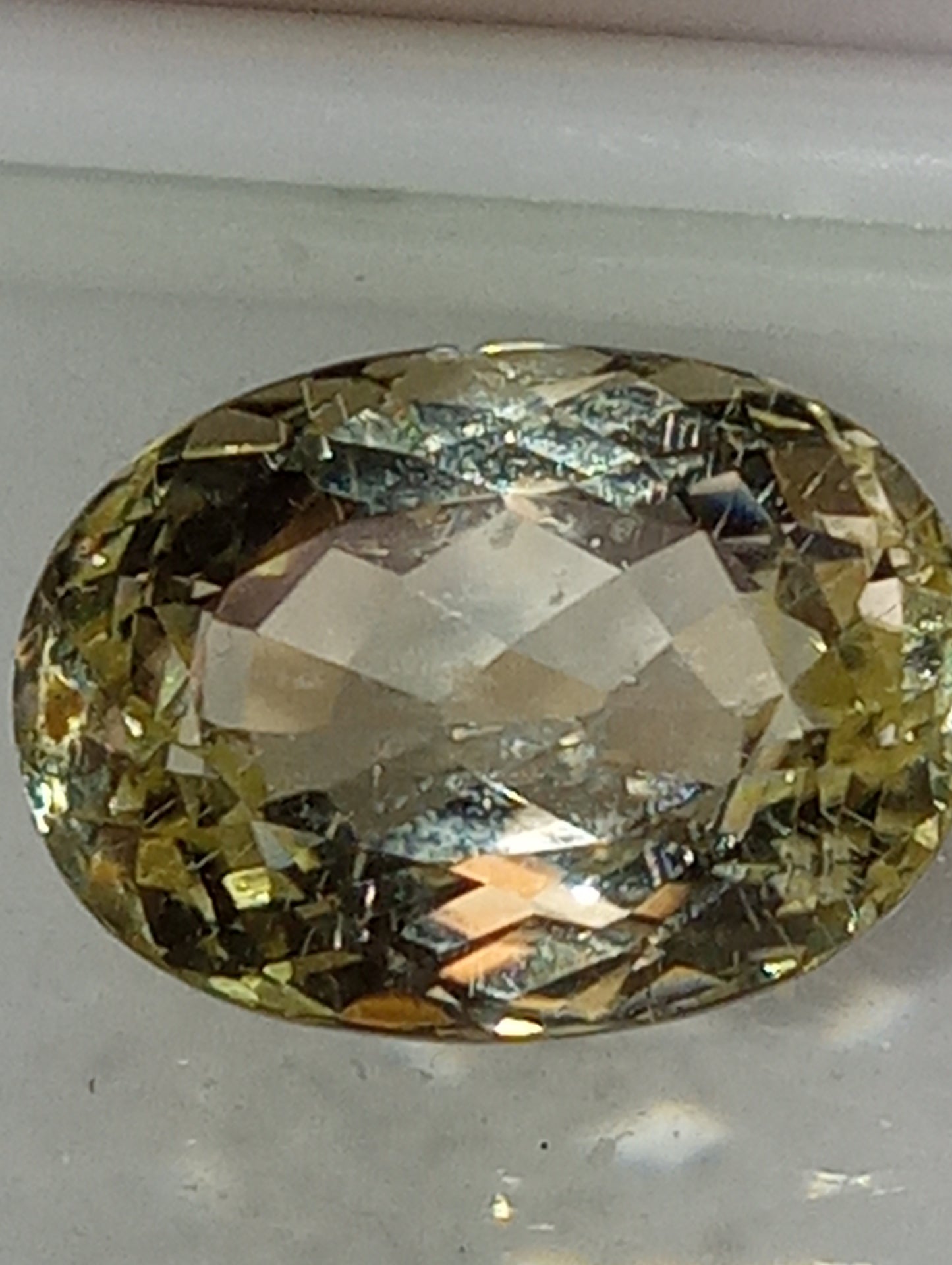 Teradora (TM)  gemstone, yellow, 14x10mm oval cut, 8.43ct