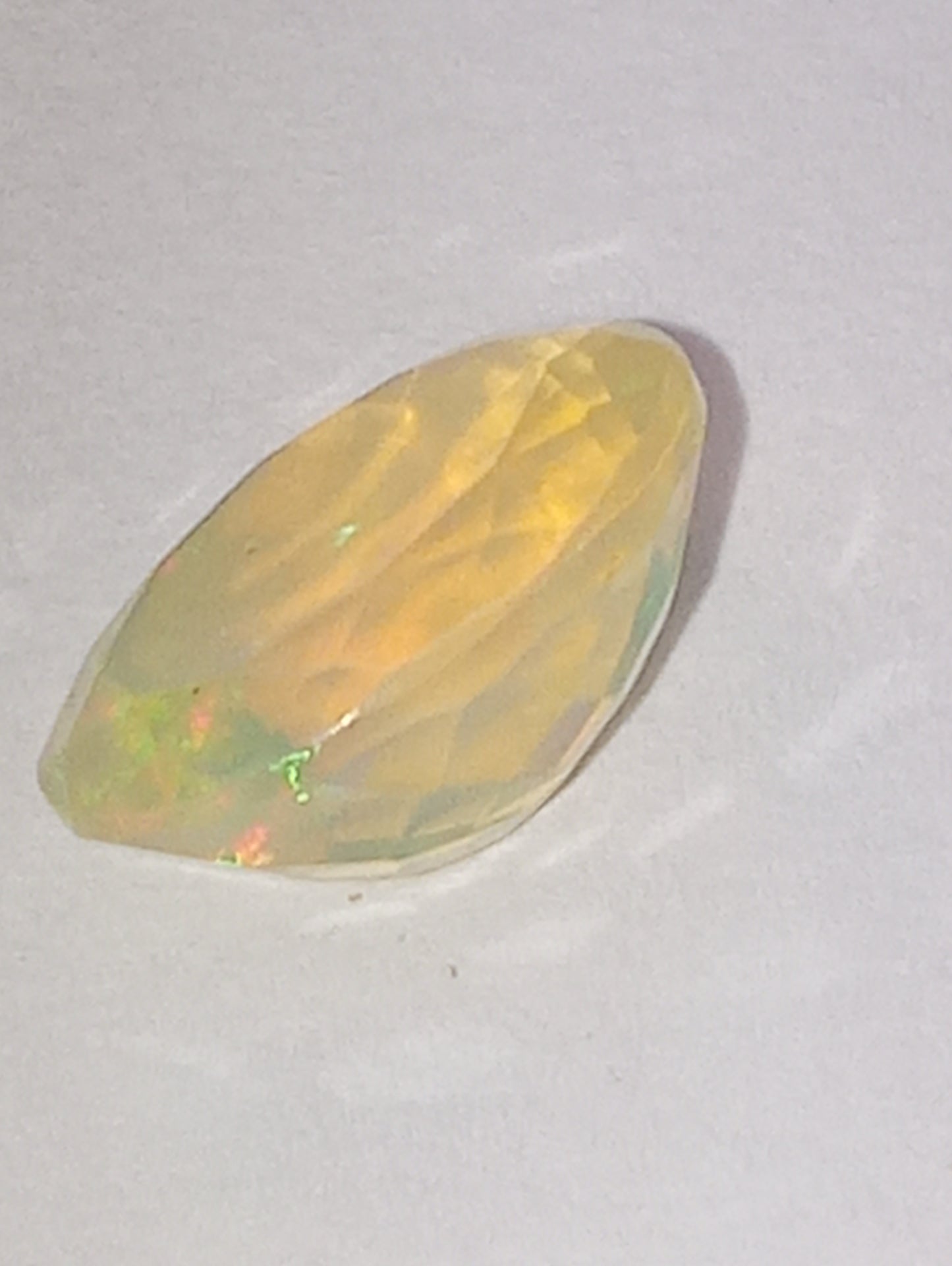 opal gemstone Ethiopian faceted 10mmx8mm oval cut, 1.32ct