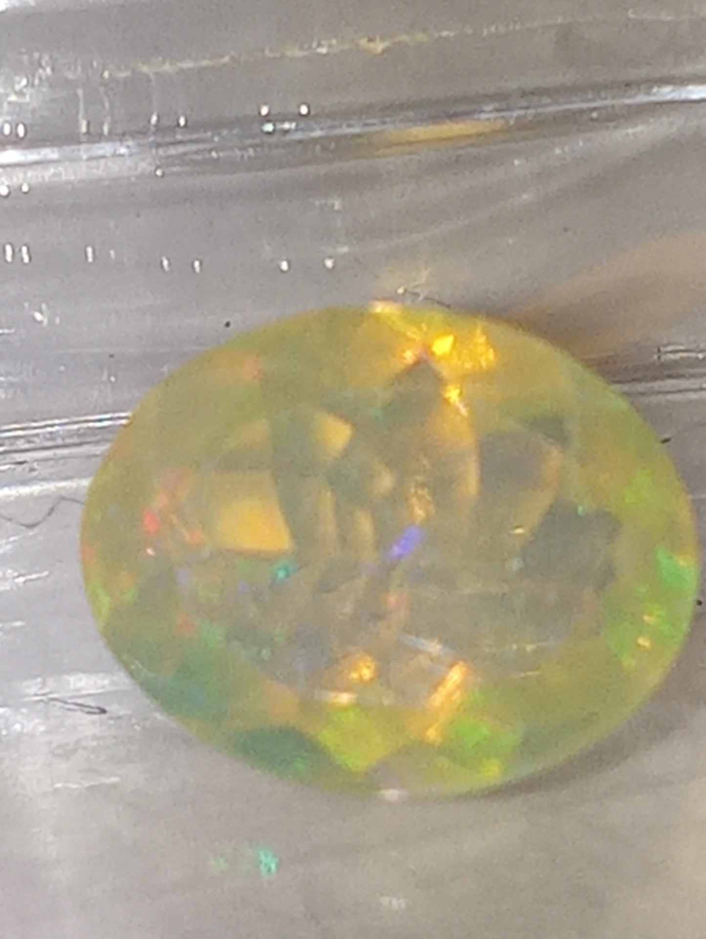 opal gemstone Ethiopian faceted 10mmx8mm oval cut, 1.32ct