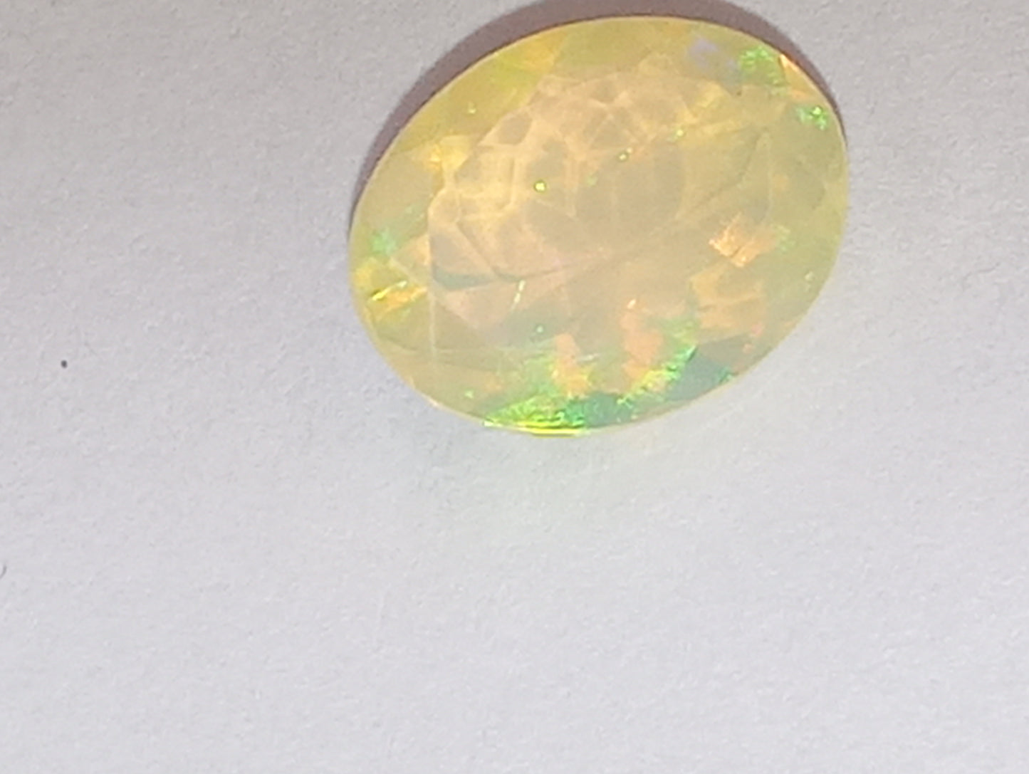 opal gemstone Ethiopian faceted 10mmx8mm oval cut, 1.32ct