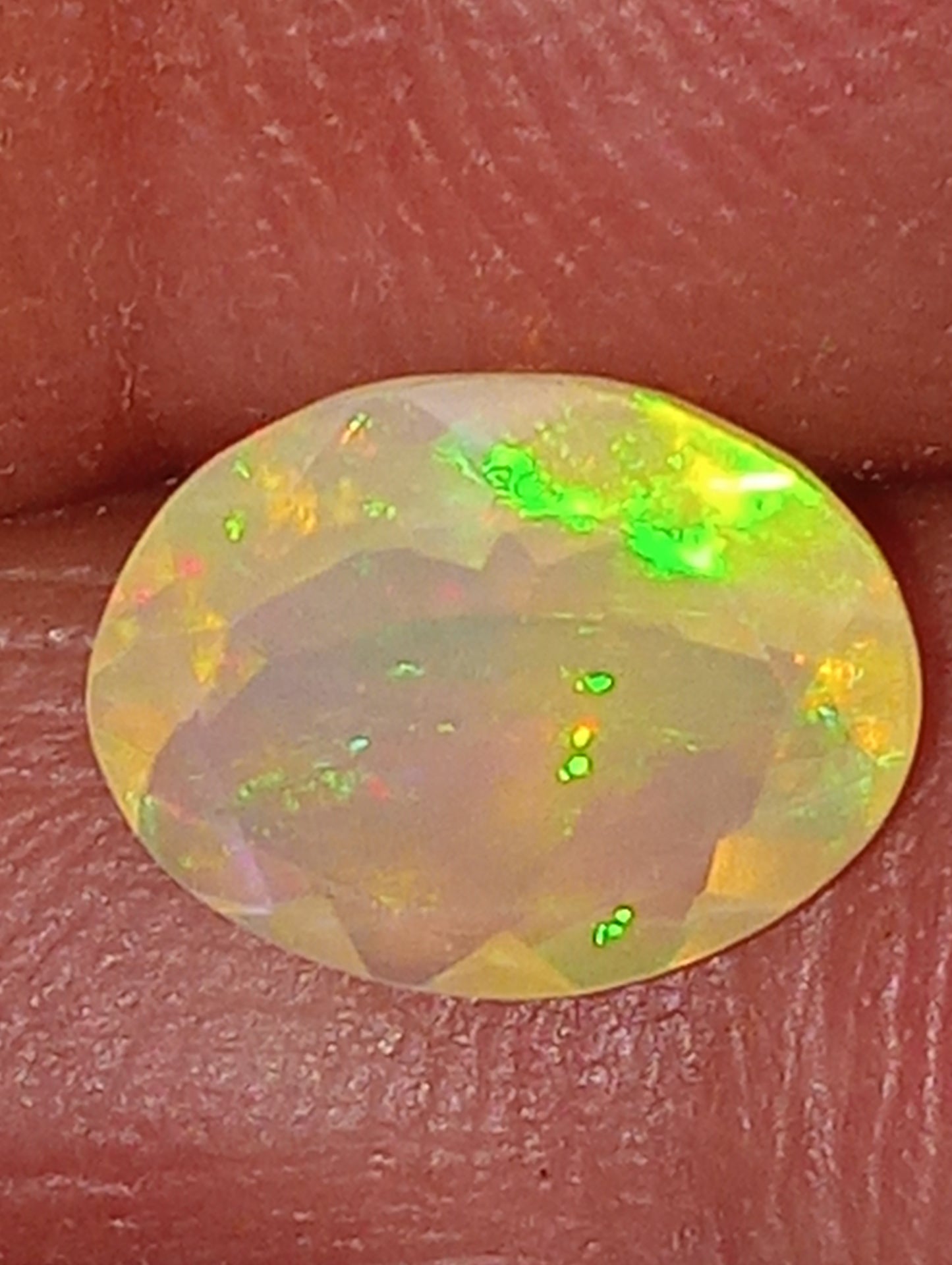 opal gemstone Ethiopian faceted 10mmx8mm oval cut, 1.32ct
