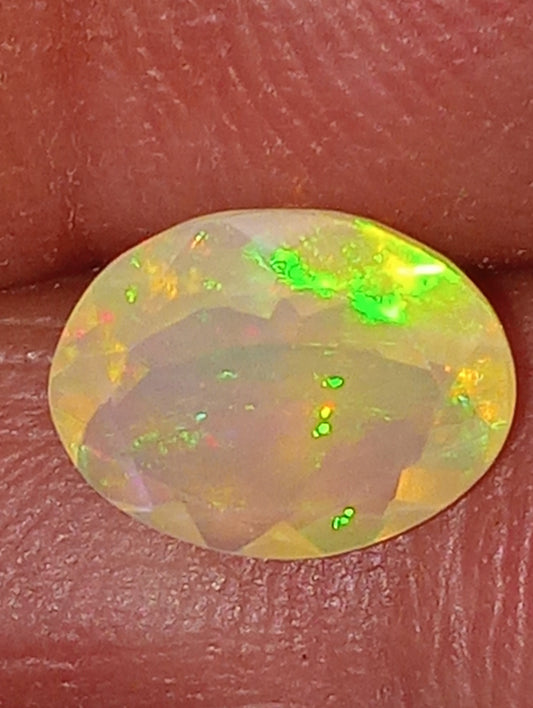 opal gemstone Ethiopian faceted 10mmx8mm oval cut, 1.32ct