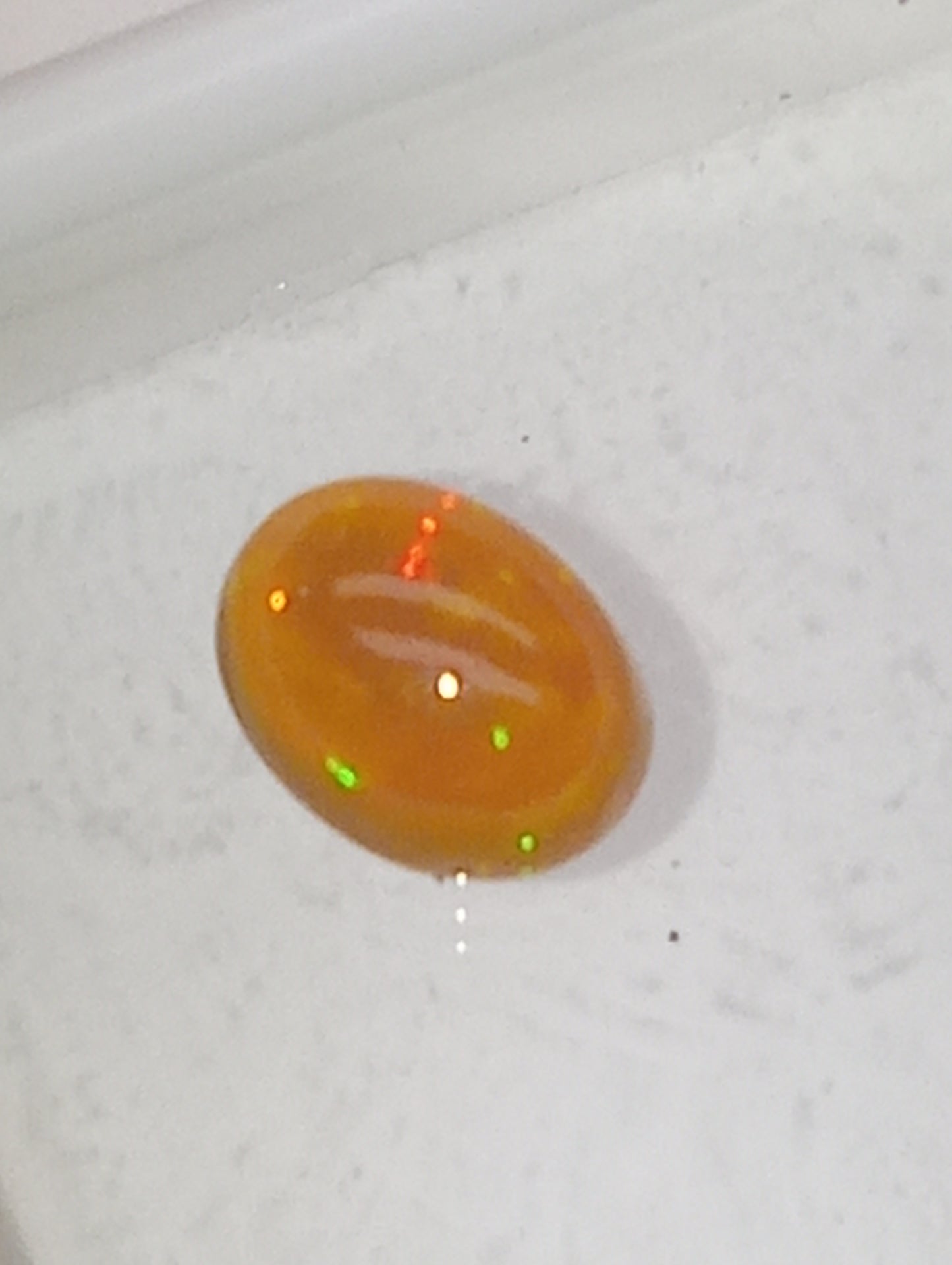 opal gemstone Ethiopian, 9mmx7mm oval cab, 1.32ct