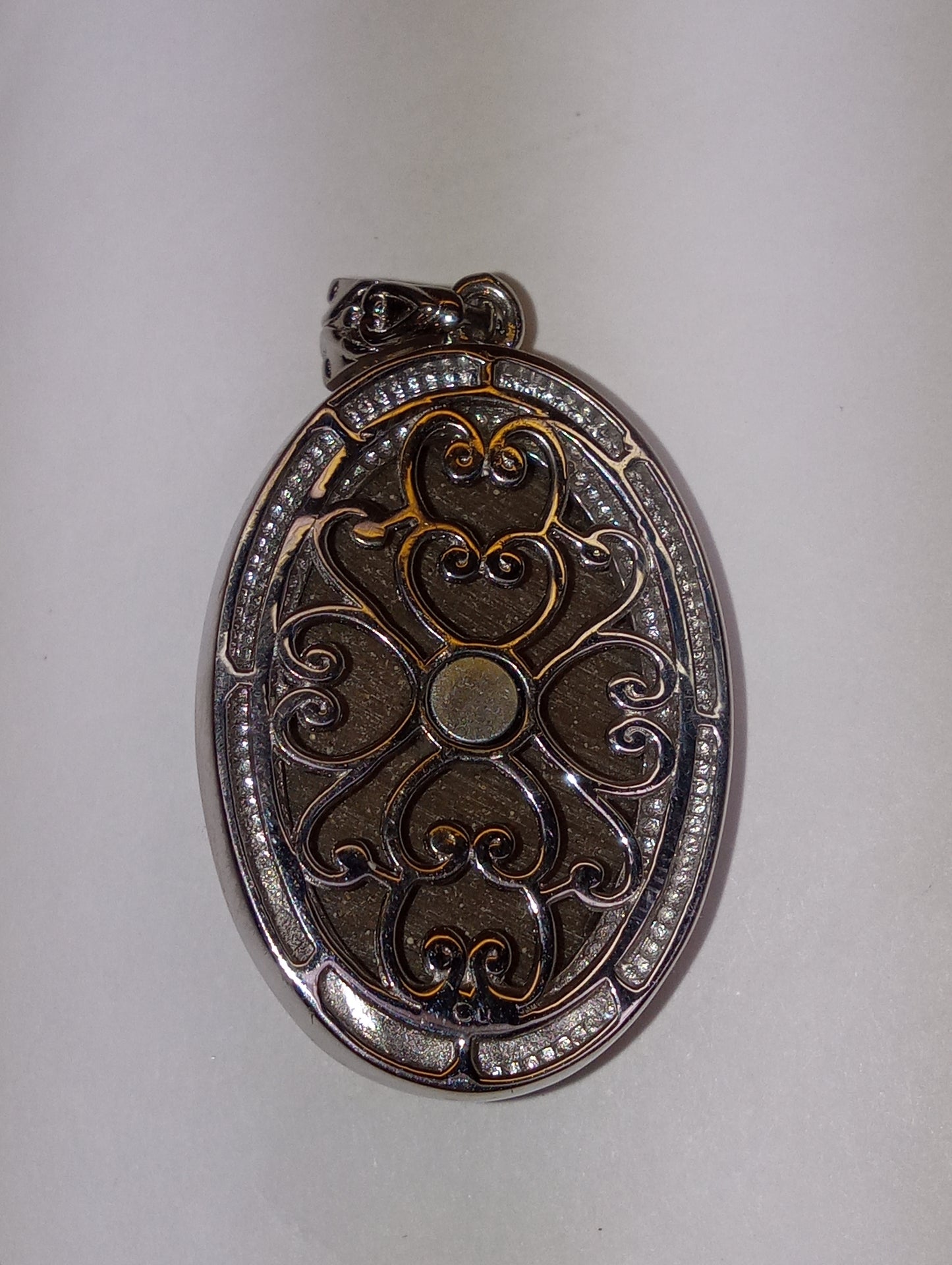 pendant, tiger's eye South African, carved in platinum over copper, with magnet, 18.15ct