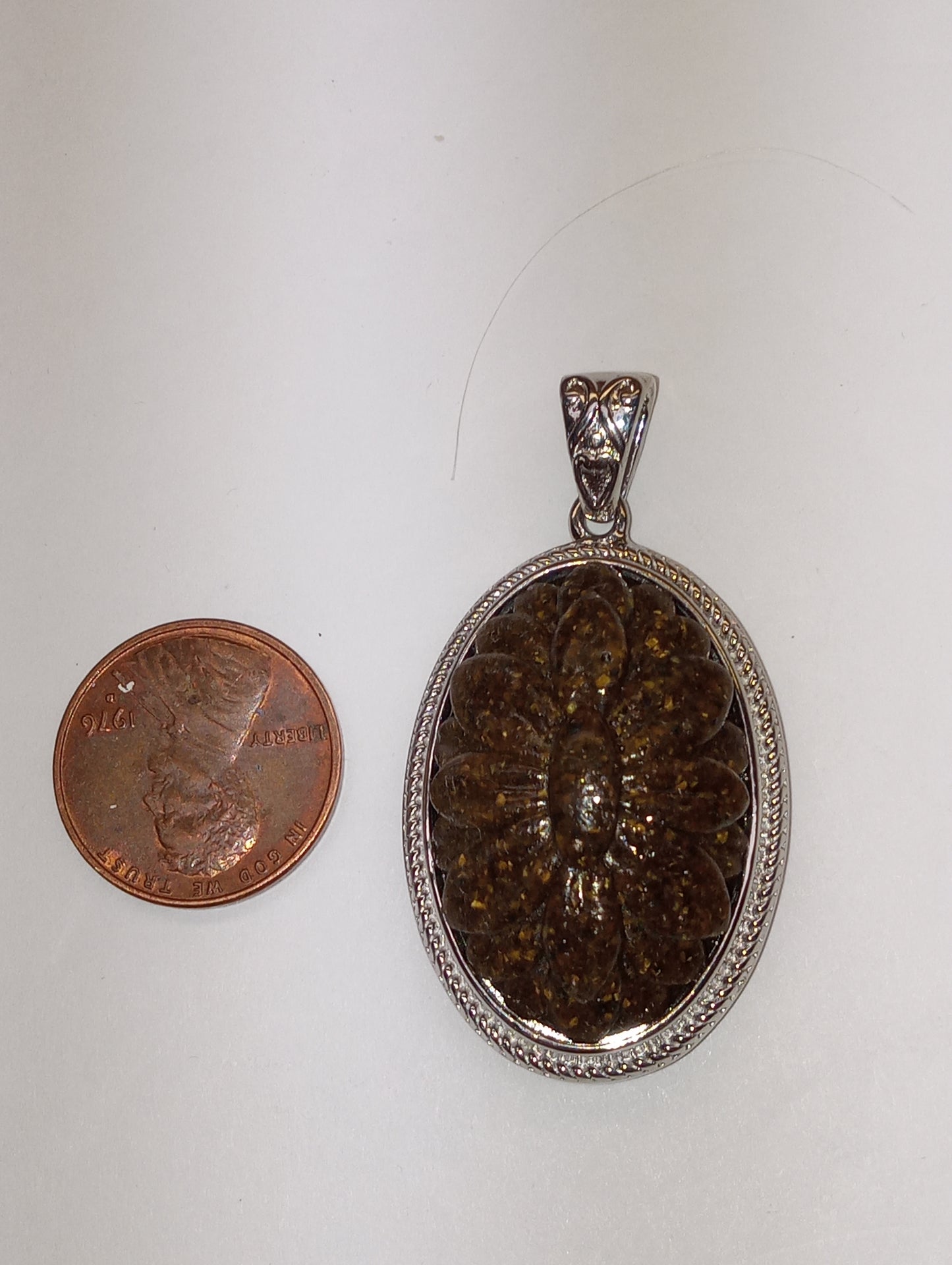pendant, tiger's eye South African, carved in platinum over copper, with magnet, 18.15ct