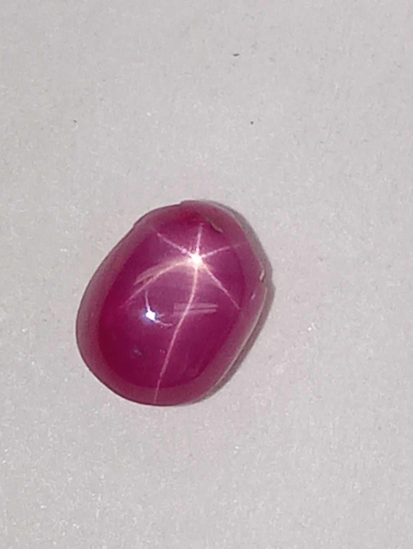 ruby gemstone Burma star, 6mmx4mm oval cabacon, 1.07ct